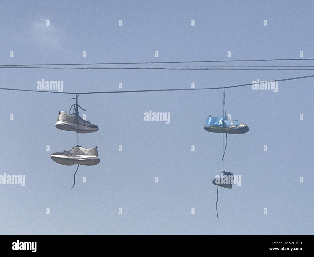 Hanging shoes on electric wire Stock Photo Alamy