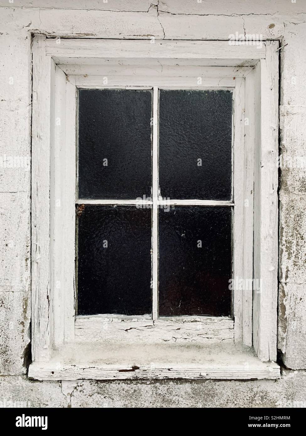Window with peeling white paint Stock Photo