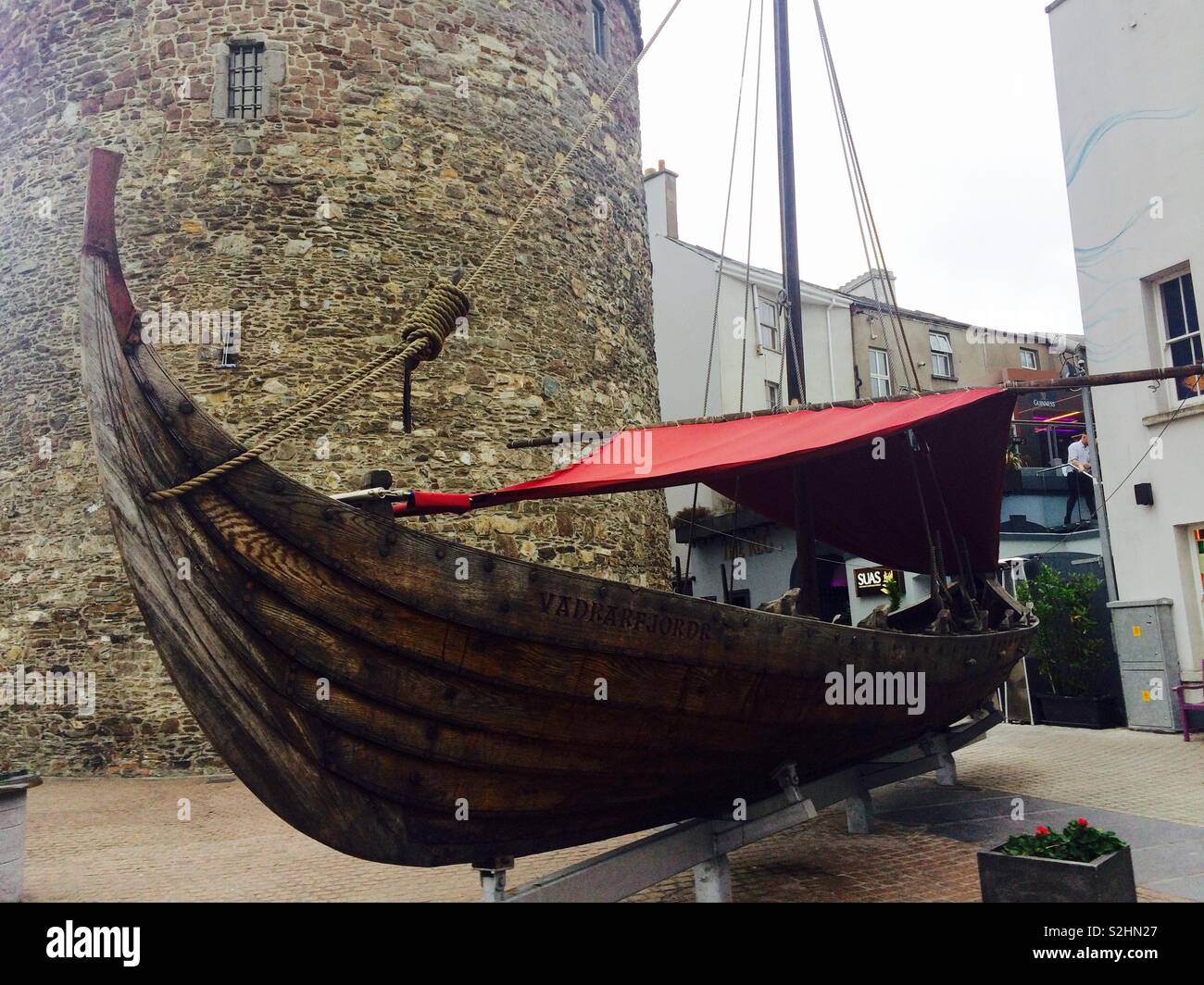 Wooden replica of a Viking or Nordic ship in the street outside King of the Vikings in Waterford Ireland Stock Photo