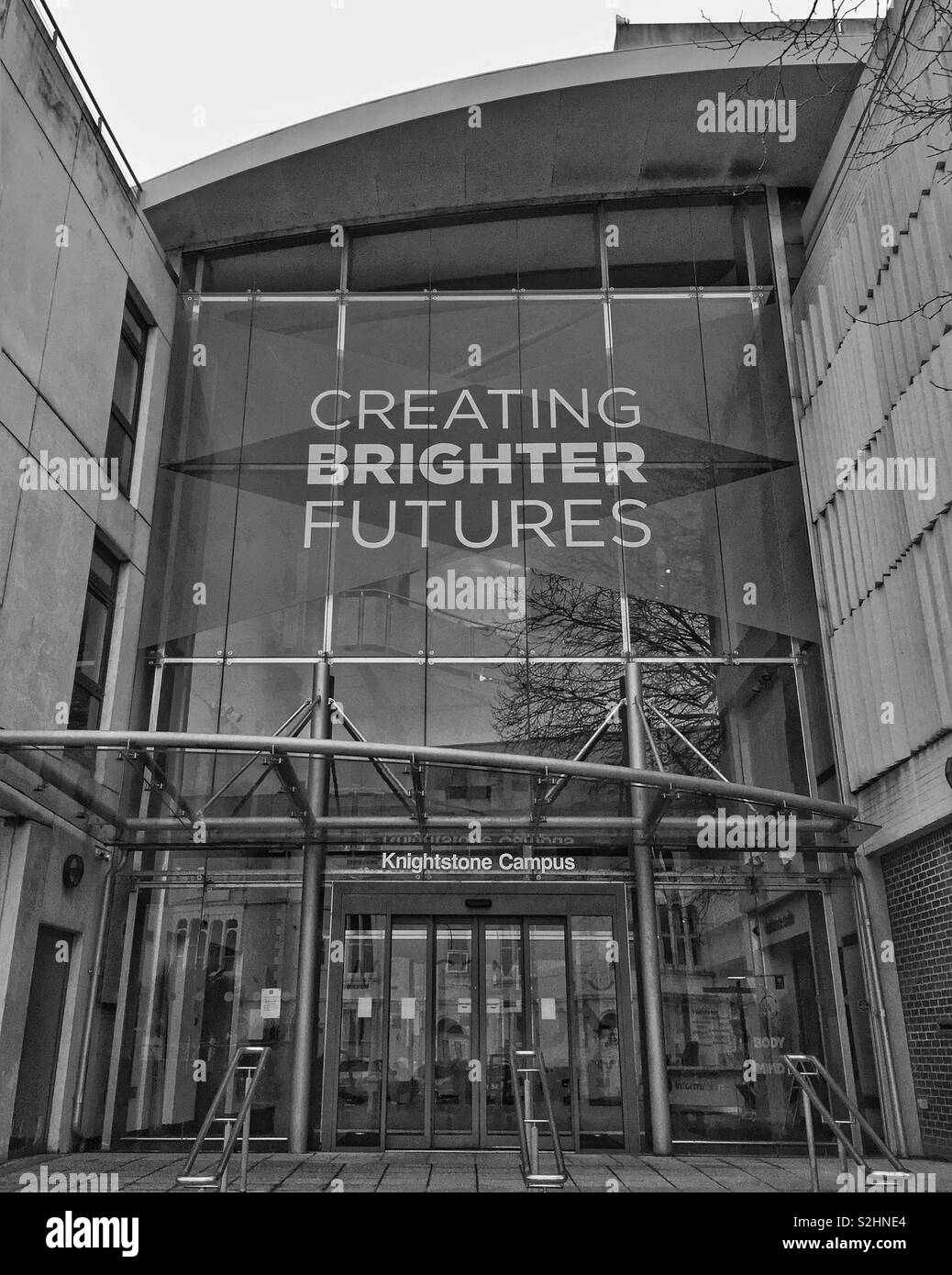 The entrance to the Knightstone Campus of Weston College in Weston-super-Mare, UK with a banner bearing the slogan “CREATING BRIGHTER FUTURES” - Smartphone Captured Stock Image