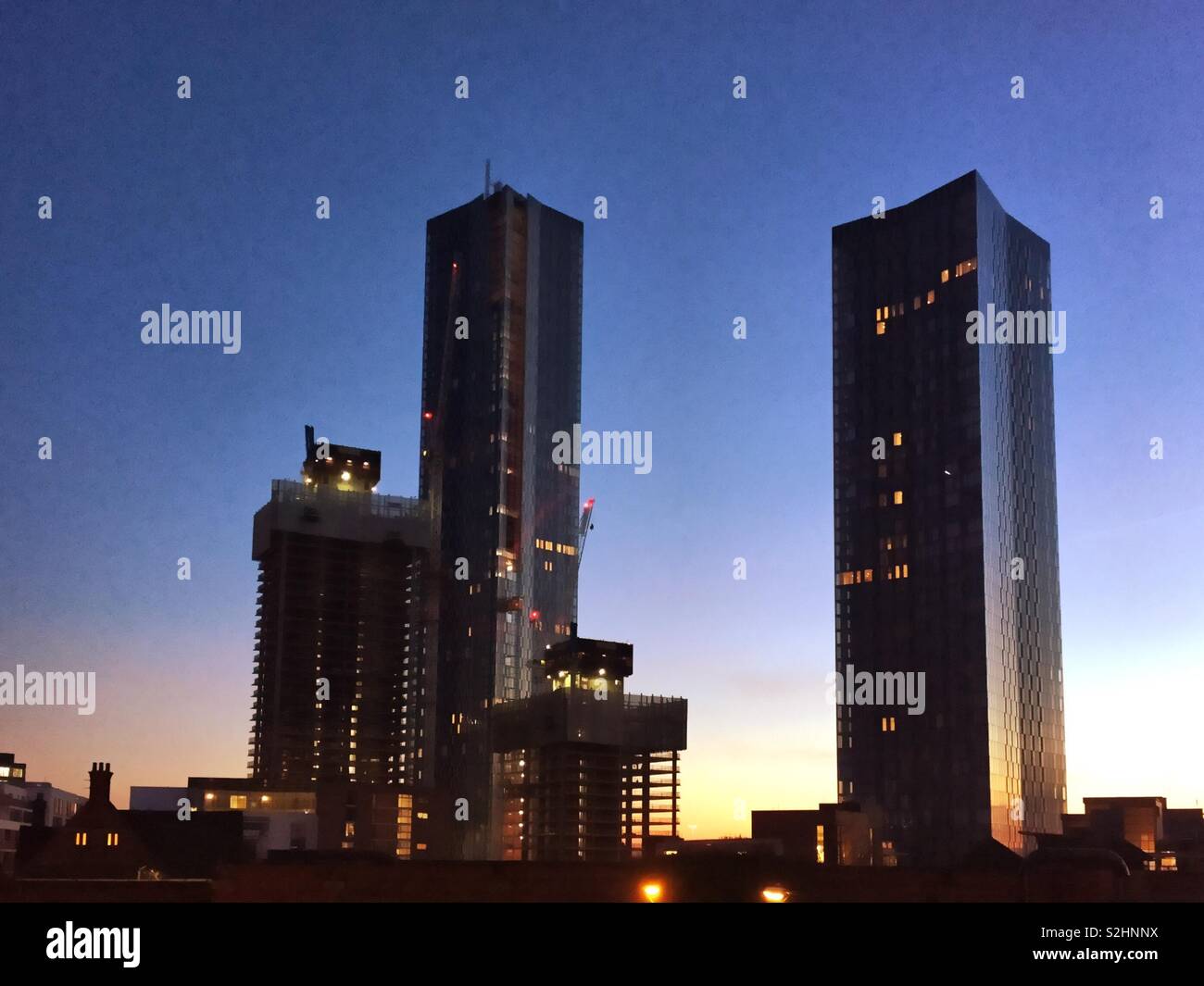 Manchester skyline at twilight.  Skyscrapers at Deansgate Square. Stock Photo