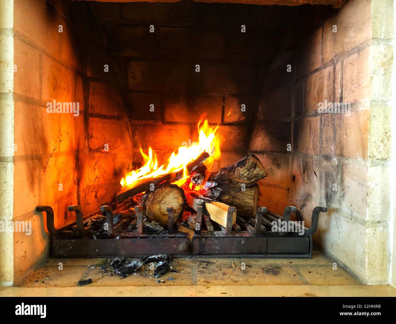 Fireplace with lit fire - Smartphone Captured Stock Image