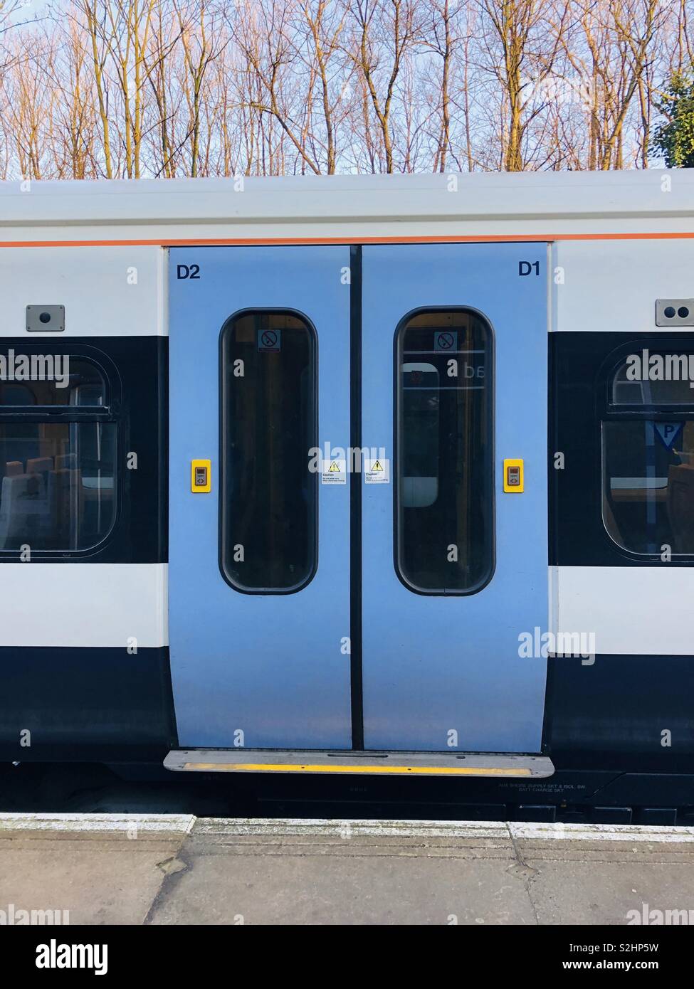 Closed overground train doors london Stock Photo Alamy
