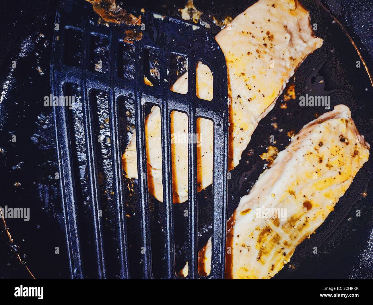 Fresh salmon steaks frying - Smartphone Captured Stock Image
