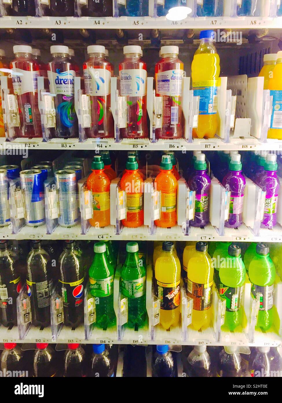 Bottles of drink in a vending machine. - Smartphone Captured Stock Image