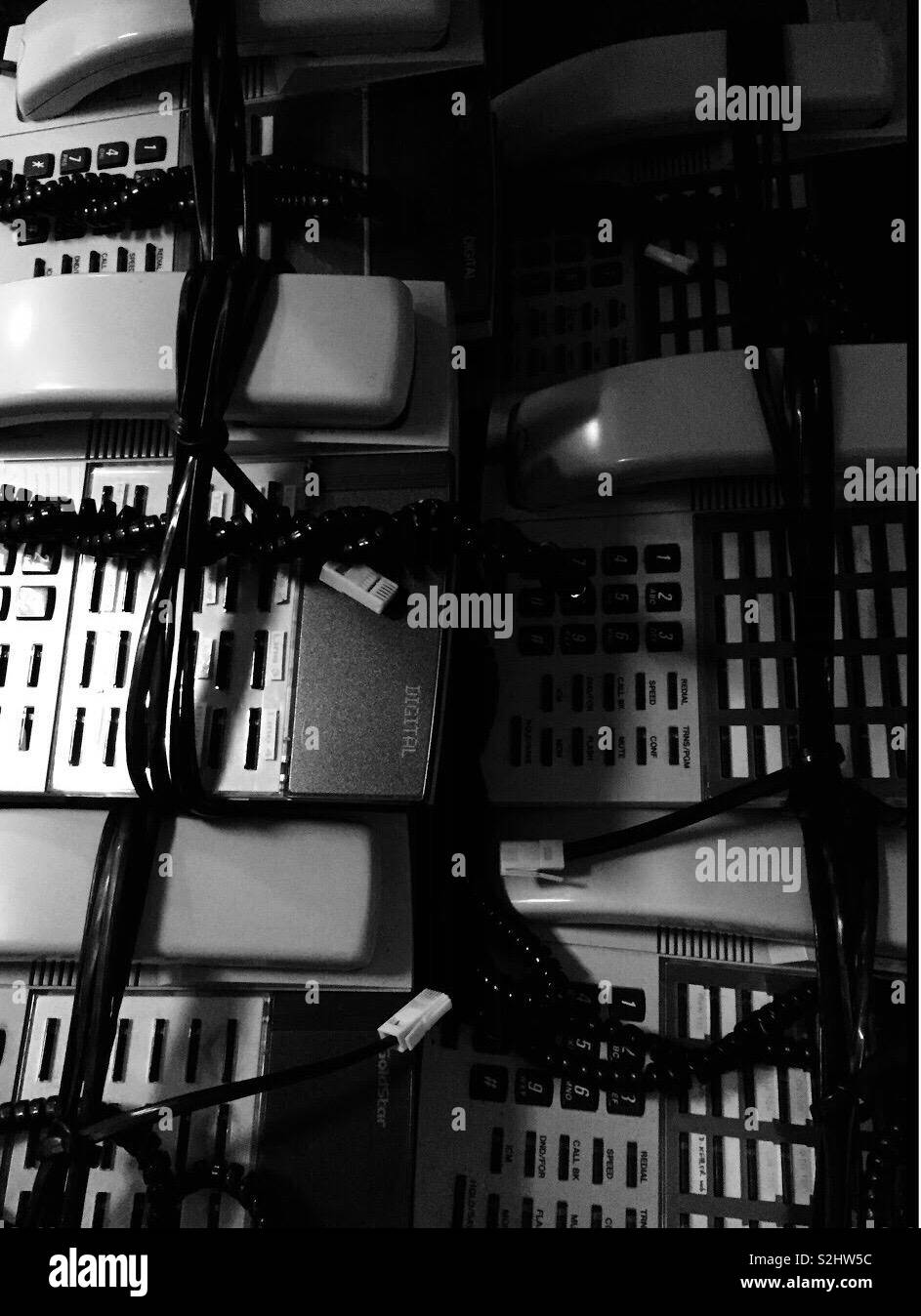 Hot line bling.  Old telephones now old technology. No need for traditional phones in modern age of mobiles and smart phones - Smartphone Captured Stock Image