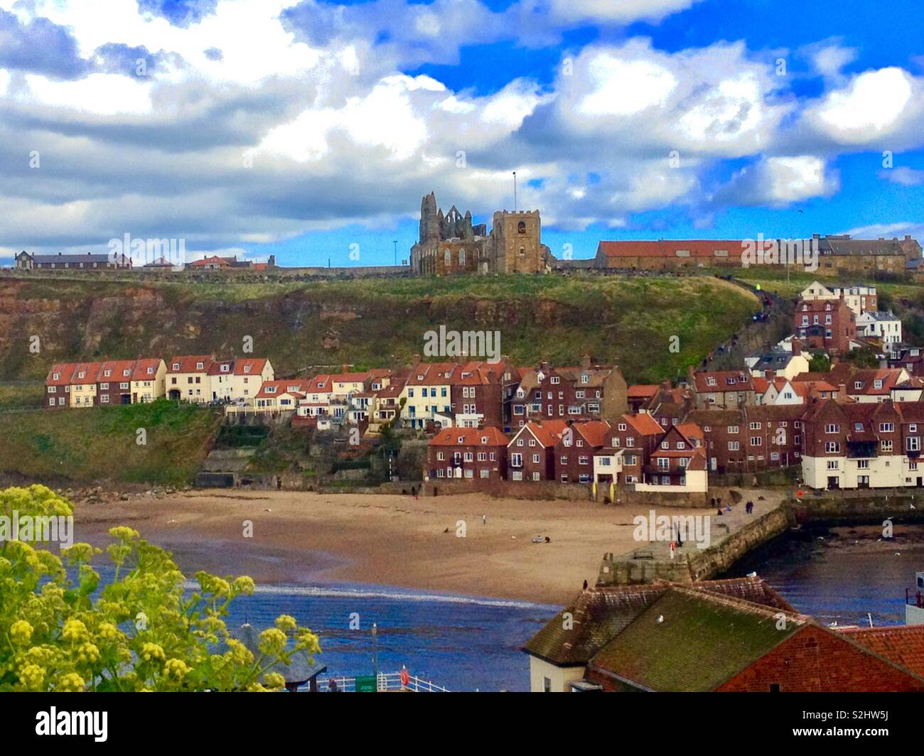 Whitby abbey overlooking the harbour Stock Photo