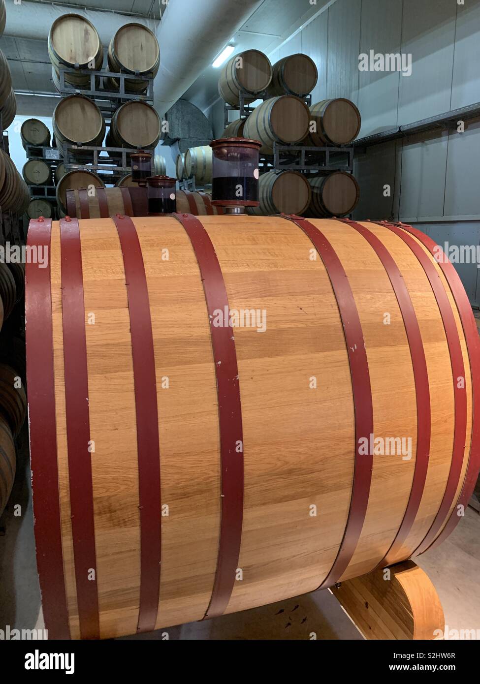 A large oak barrel in the Tabor winery in Kfar Tavor in Israel. - Smartphone Captured Stock Image