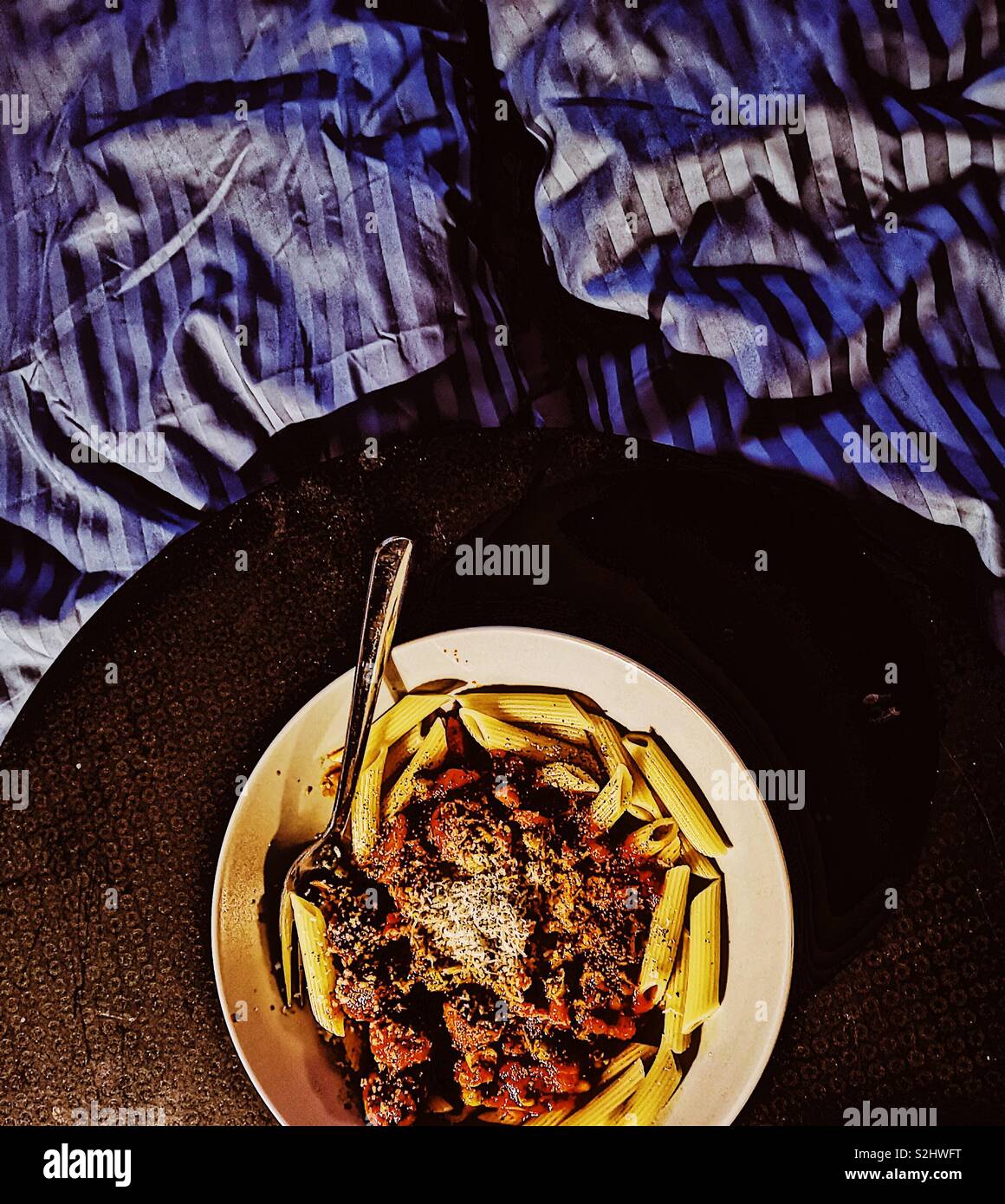 Pasta dinner in bed - Smartphone Captured Stock Image