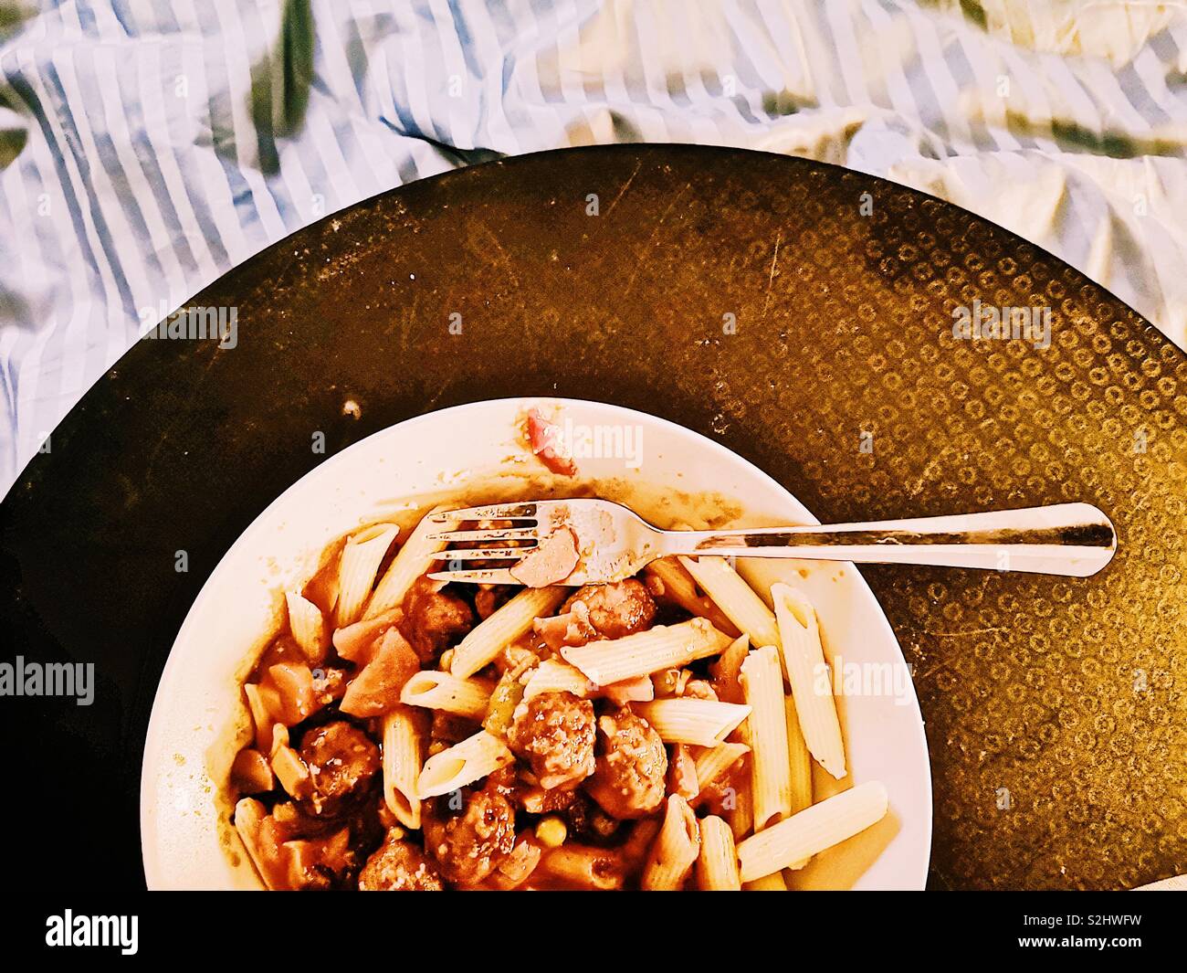 Pasta dinner in bed - Smartphone Captured Stock Image