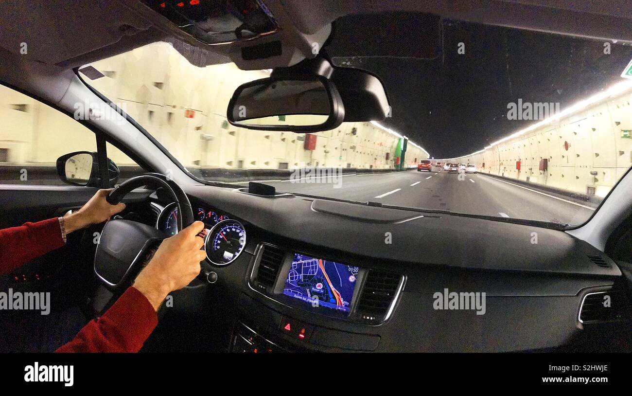 Driving in a tunnel. View from inside the car. - Smartphone Captured Stock Image