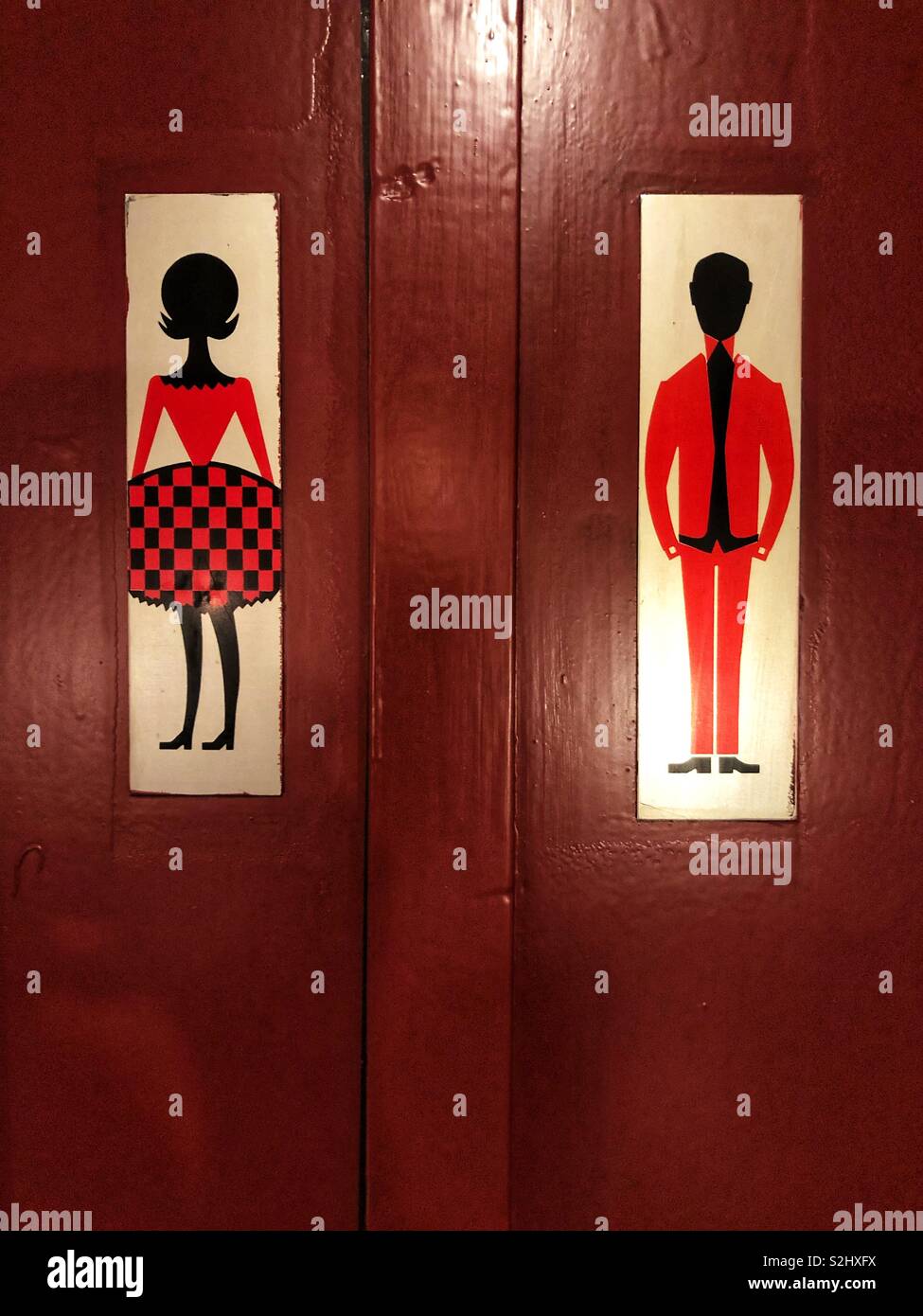 His and hers vintage restroom sign Stock Photo - Alamy