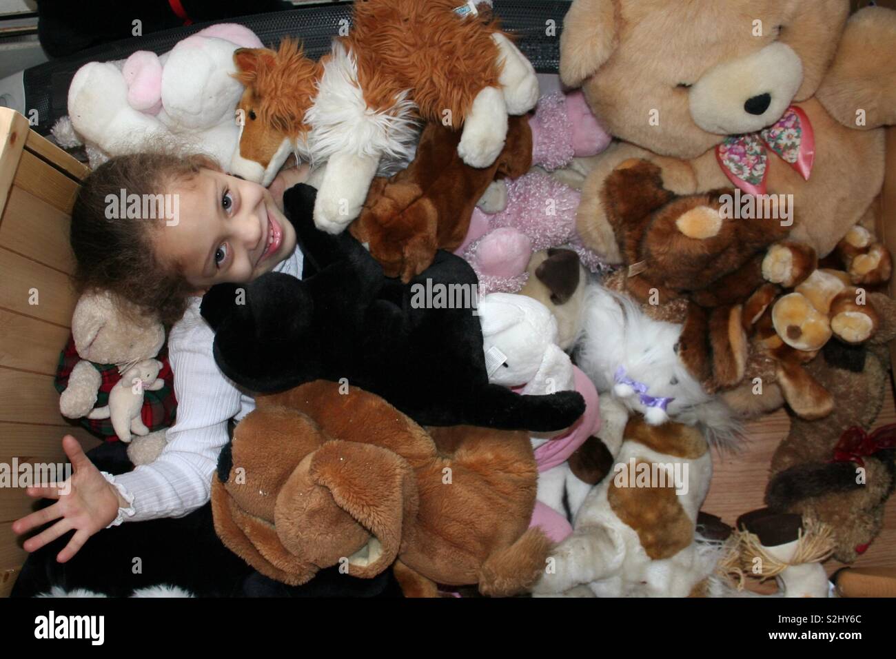 Young girl with stuffed animals Stock Photo - Alamy