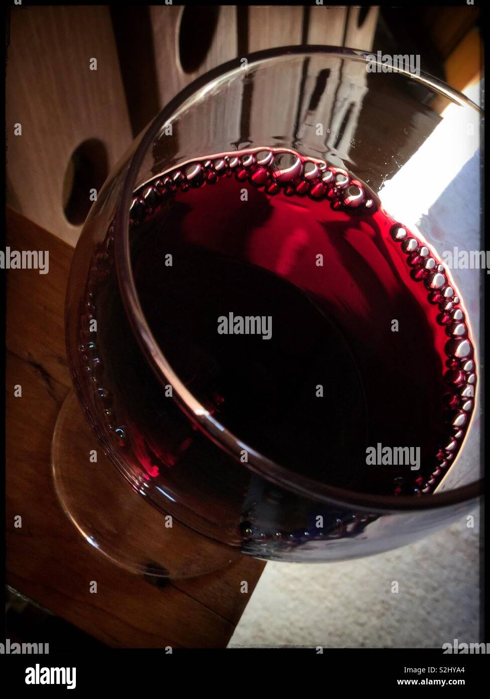 Sampling a glass of 2018 Syrah red wine, Catalonia, Spain. - Smartphone Captured Stock Image