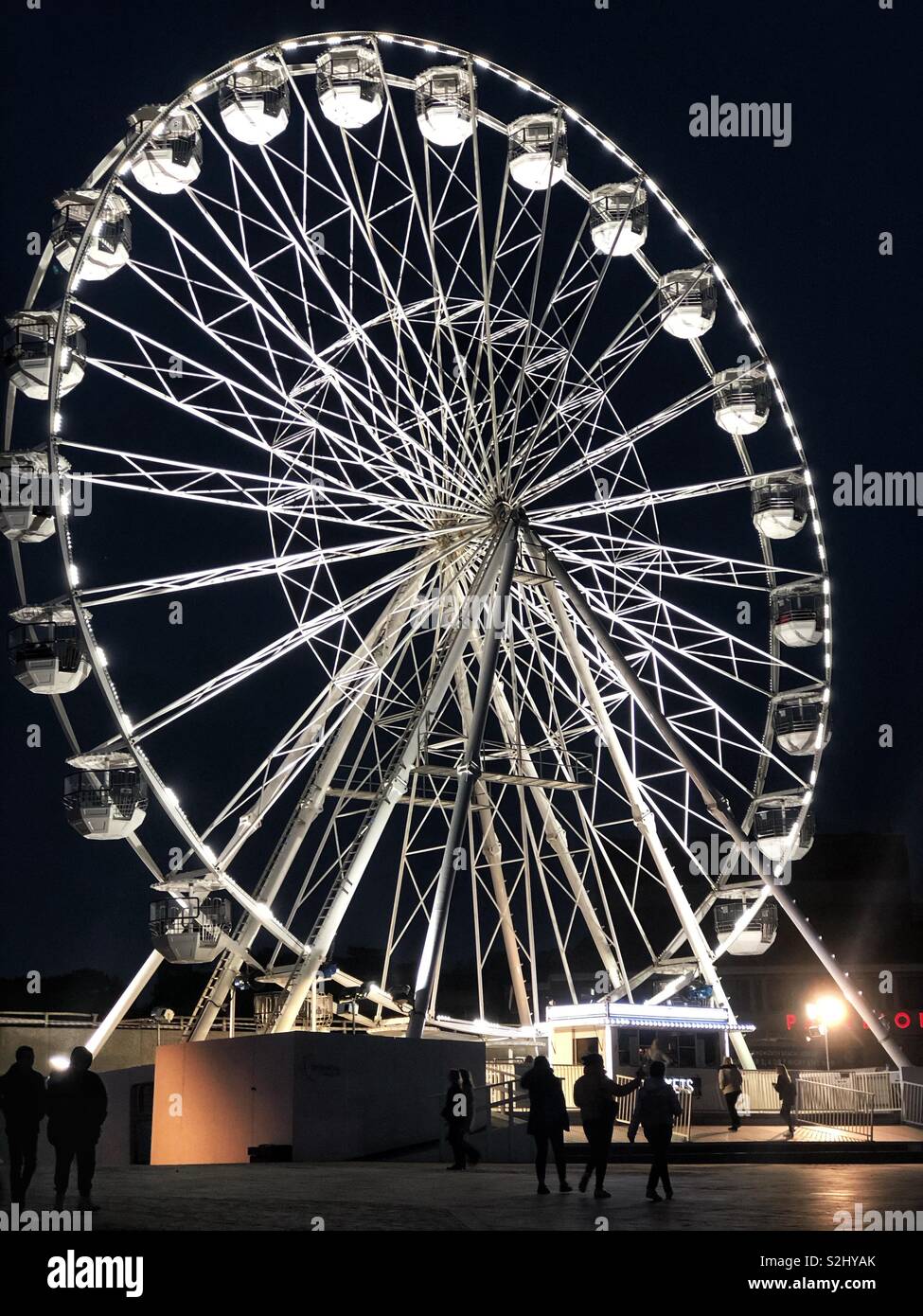 The big wheel in Bournemouth lit up at night. - Smartphone Captured Stock Image