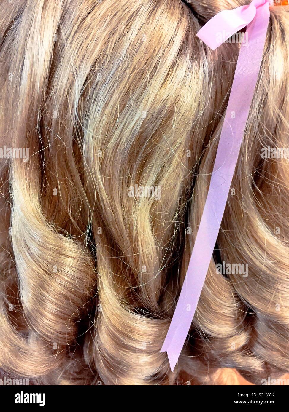 Close up of curly hair and ribbon, USA Stock Photo