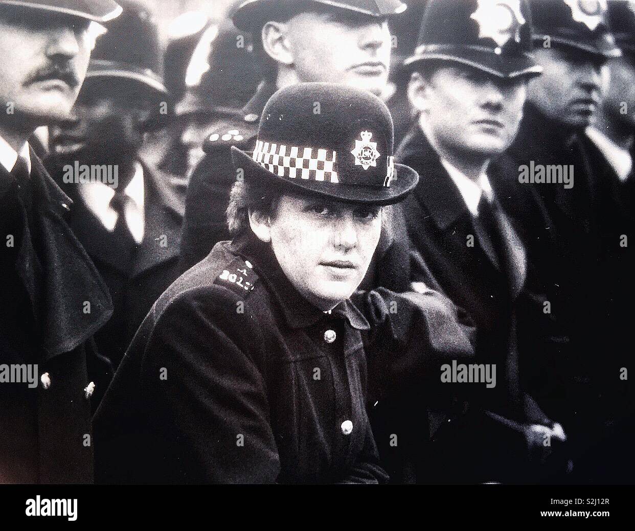 A WPC looks into the camera. - Smartphone Captured Stock Image