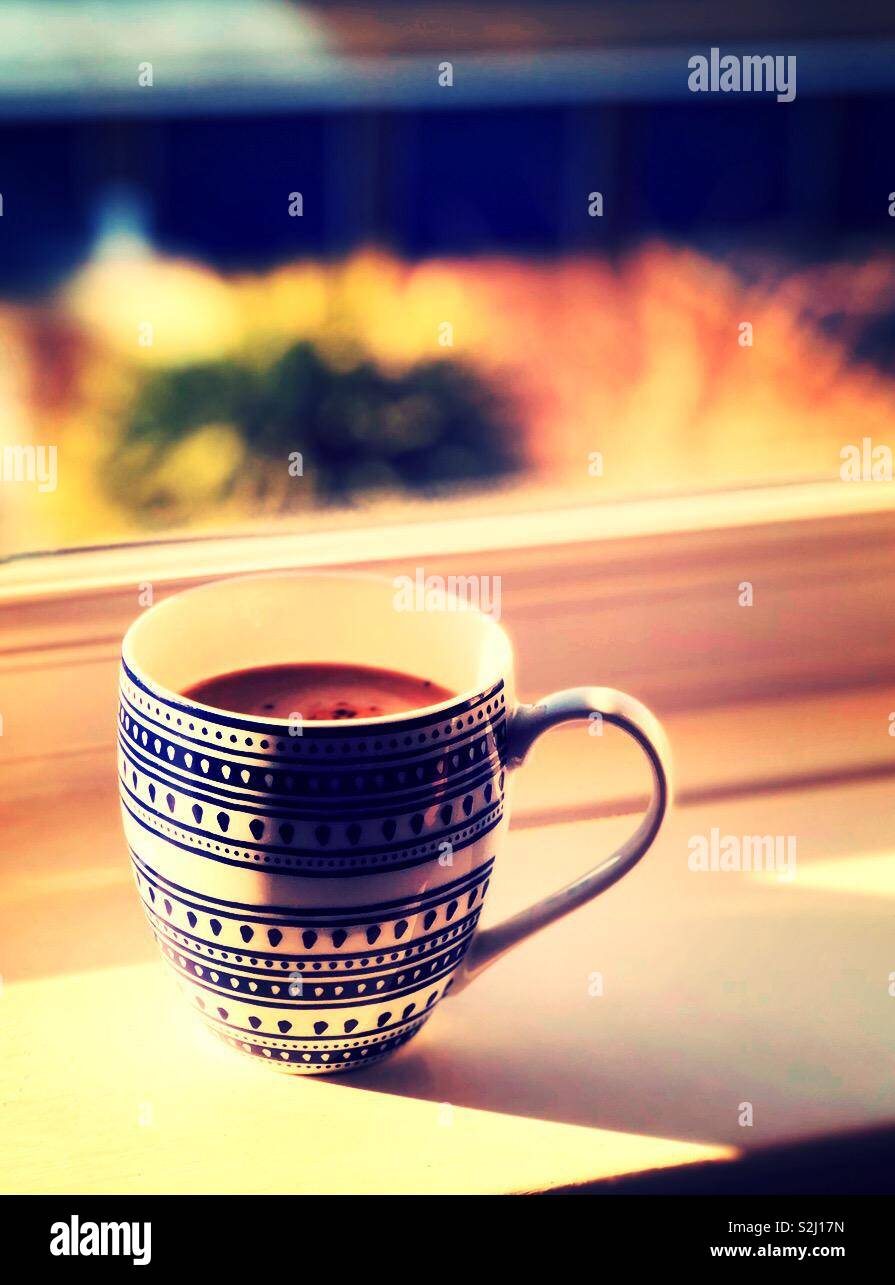 Morning mug of coffee on the windowsill - Smartphone Captured Stock Image
