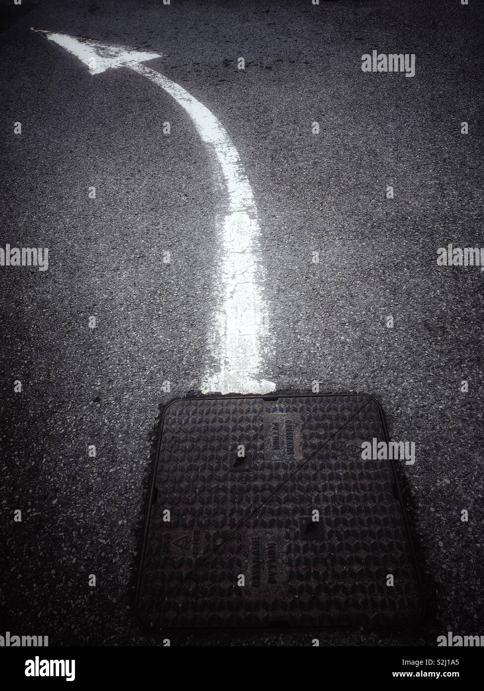 Turn left when leaving manhole - Smartphone Captured Stock Image