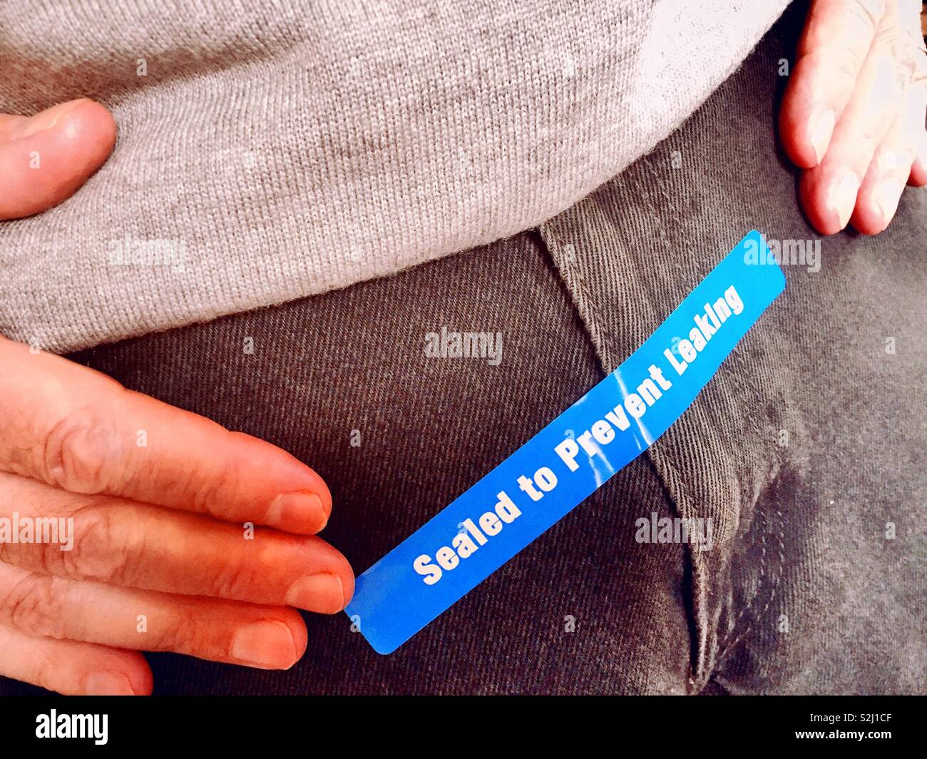 Concept of incontinent mature men having taken medicine to prevent leakage, USA - Smartphone Captured Stock Image
