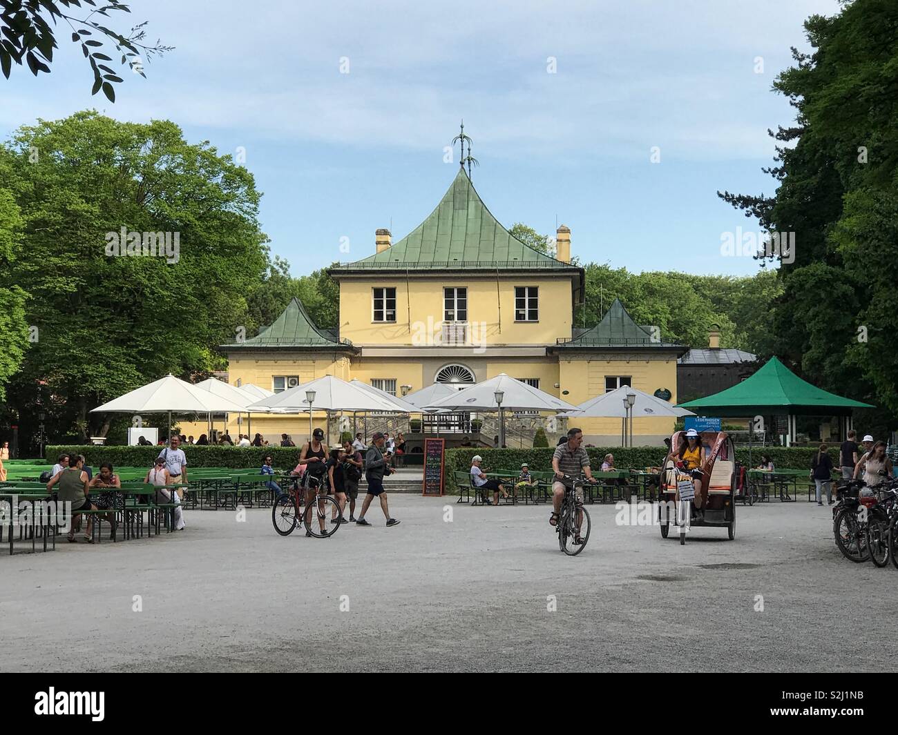 Munich, Germany - June 22, 217: The Chinese Tower beer garden and restaurant, operated by Haberl Gastronomie, is shown during an afternoon day in the European city’s English Garden. - Smartphone Captured Stock Image