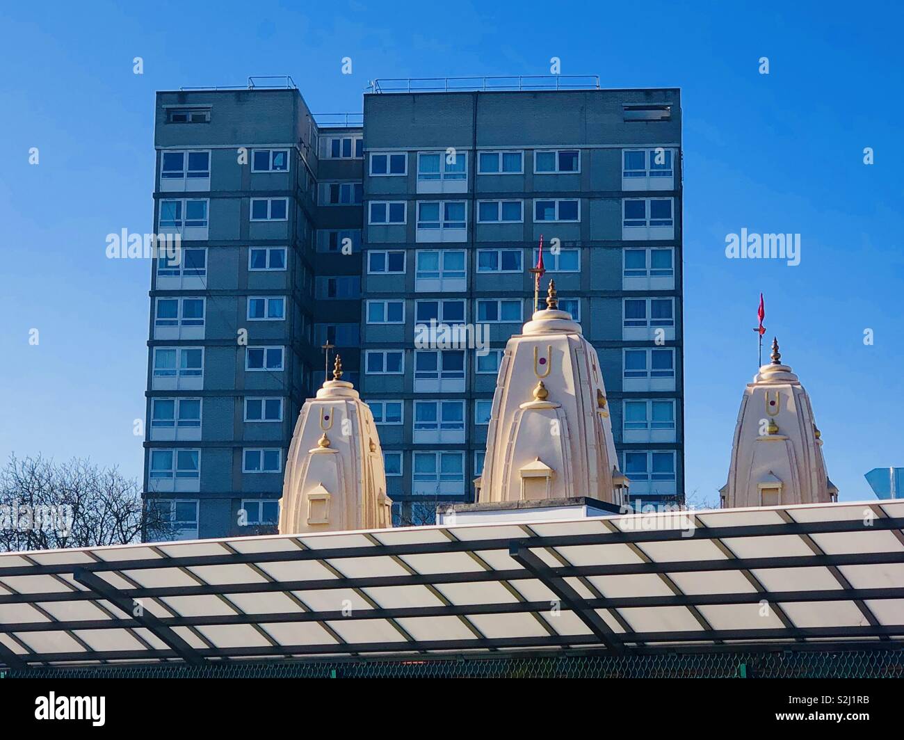 Temple with block of flats behind in plumstead london Stock Photo
