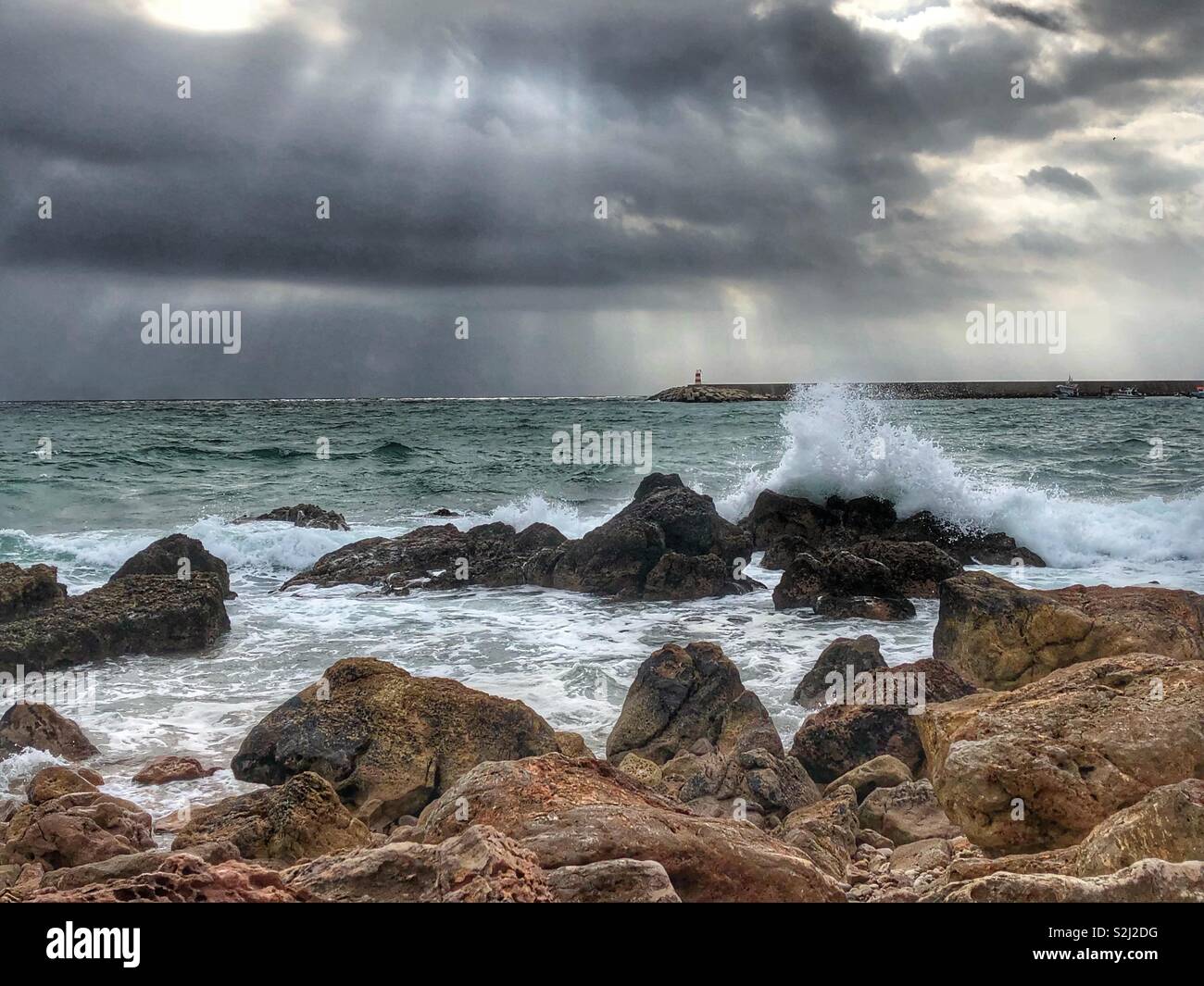 Sea breaking over rocks in winter - Smartphone Captured Stock Image