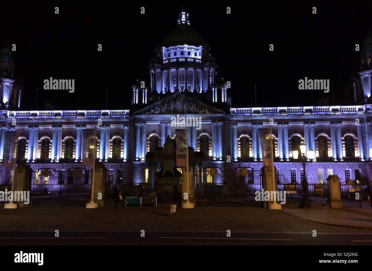 Belfast City Hall, Northern Ireland at night-a listed building, completed in 1906 and renovated 2009. This majestic building is often lit imaginatively at night. Inside are many fine features. Stock Photo
