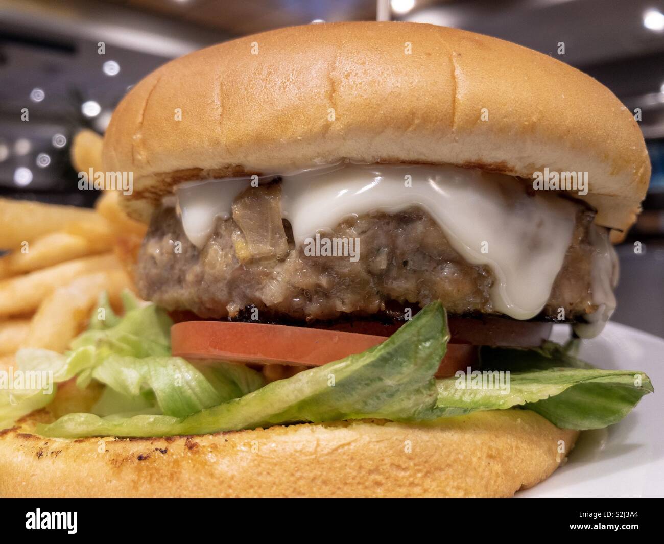 Hamburger closeup at a dinner. - Smartphone Captured Stock Image