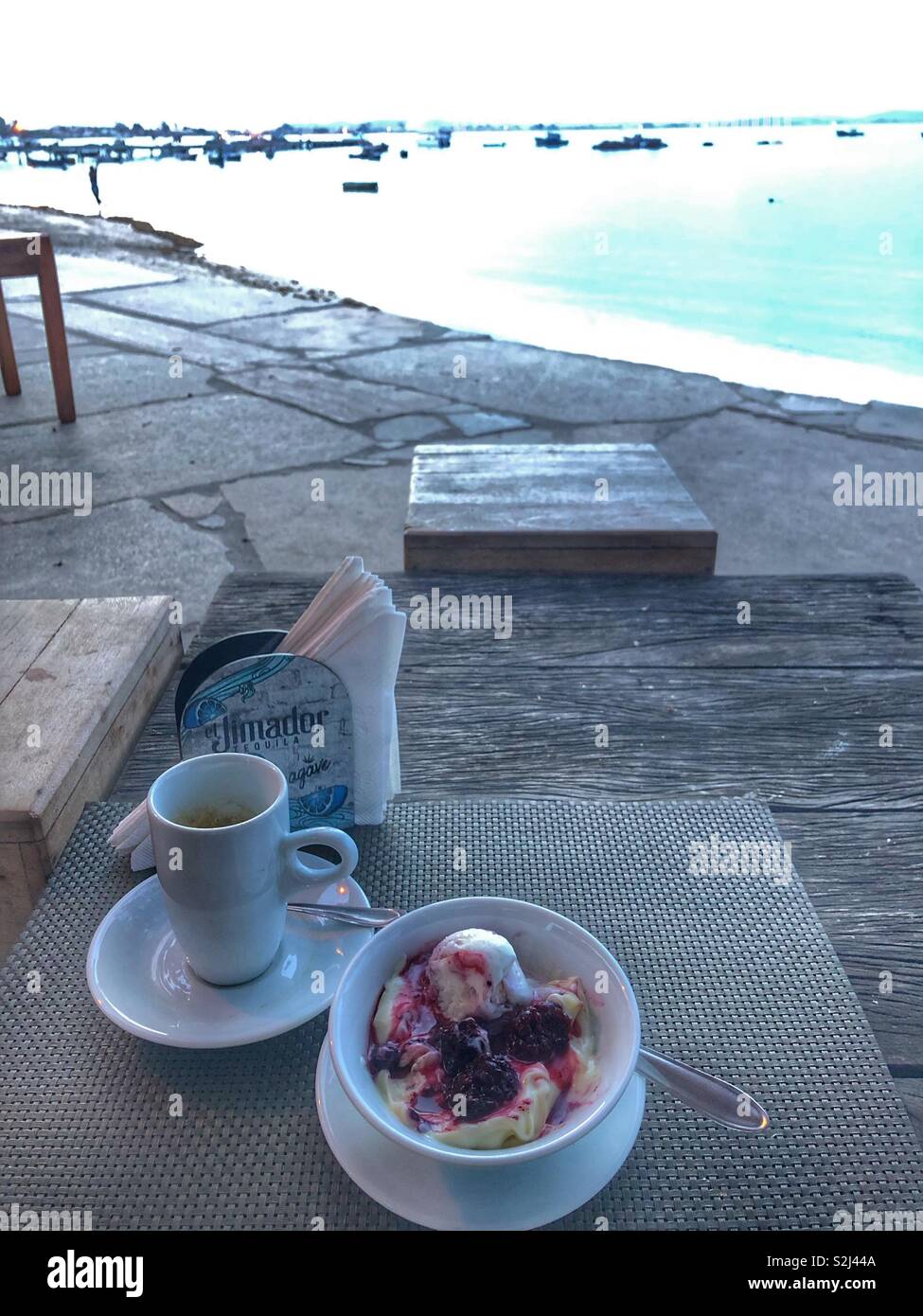 Enjoying dessert by the sea. - Smartphone Captured Stock Image