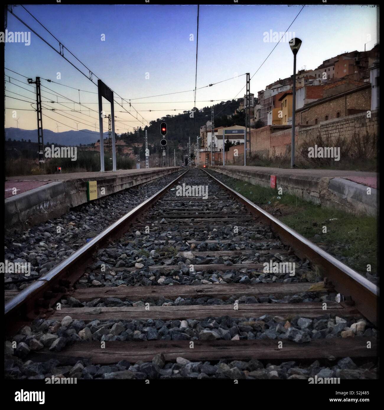 The empty train station in Ascó at dusk, Catalonia, Spain. - Smartphone Captured Stock Image