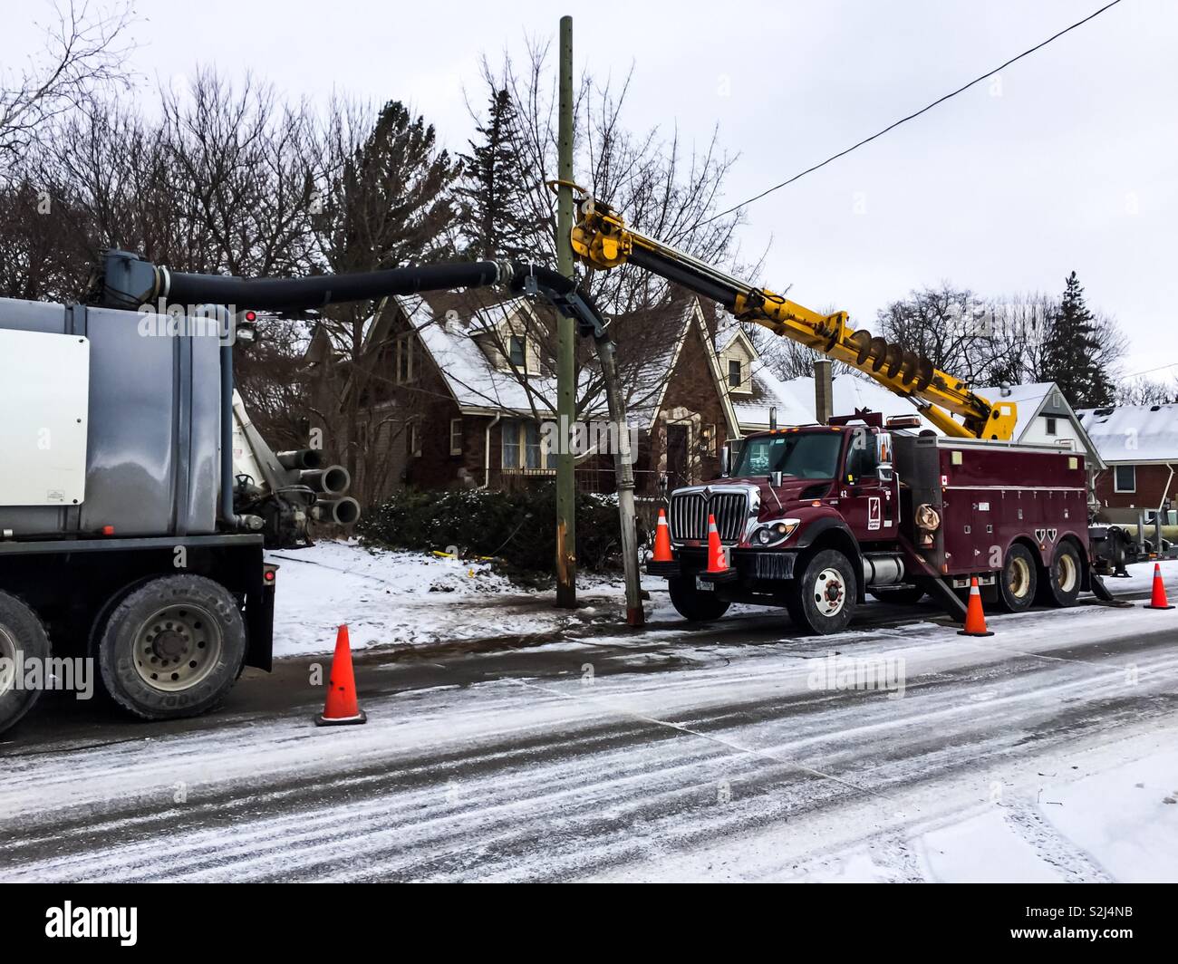 Installing a lamp post in winter - Smartphone Captured Stock Image