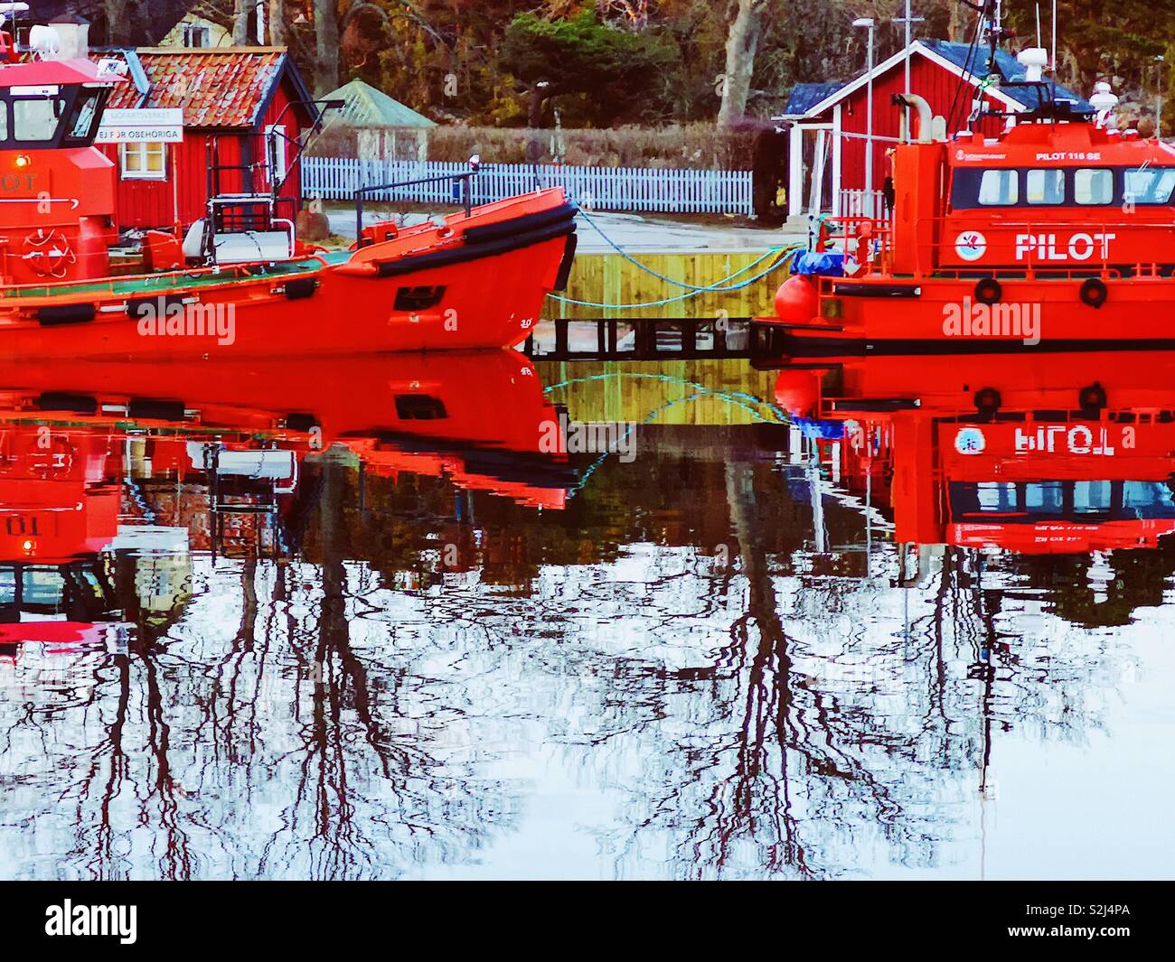 Pilot boats and reflection, Sandhamn harbour, Stockholm archipelago, Sweden, Scandinavia. Island in the outer archipelago popular for sailing and yachting since the 19th century - Smartphone Captured Stock Image