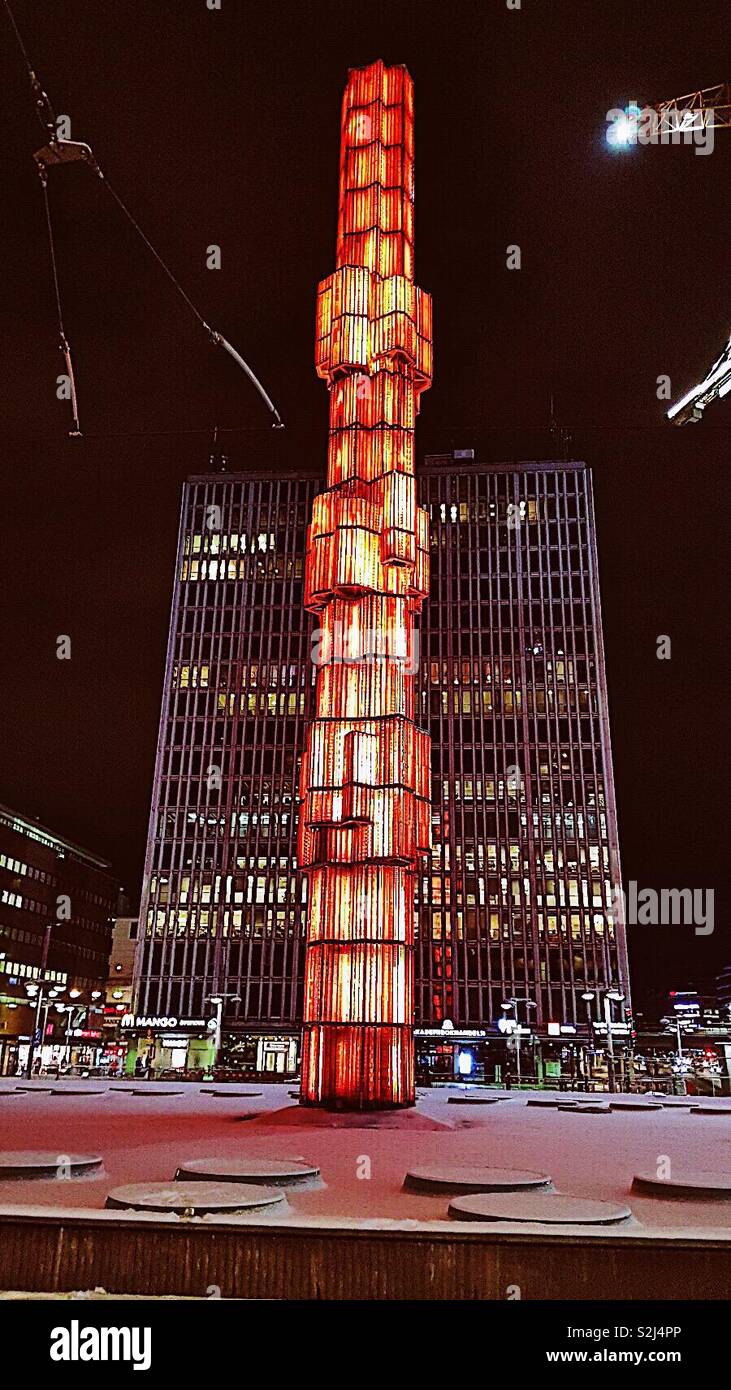 Sergels Torg obelisk illuminated at night, Stockholm, Sweden, Scandinavia. 37 mette tall glass obelisk was designed by Edvin Ohrstrom and completed in 1974 - Smartphone Captured Stock Image