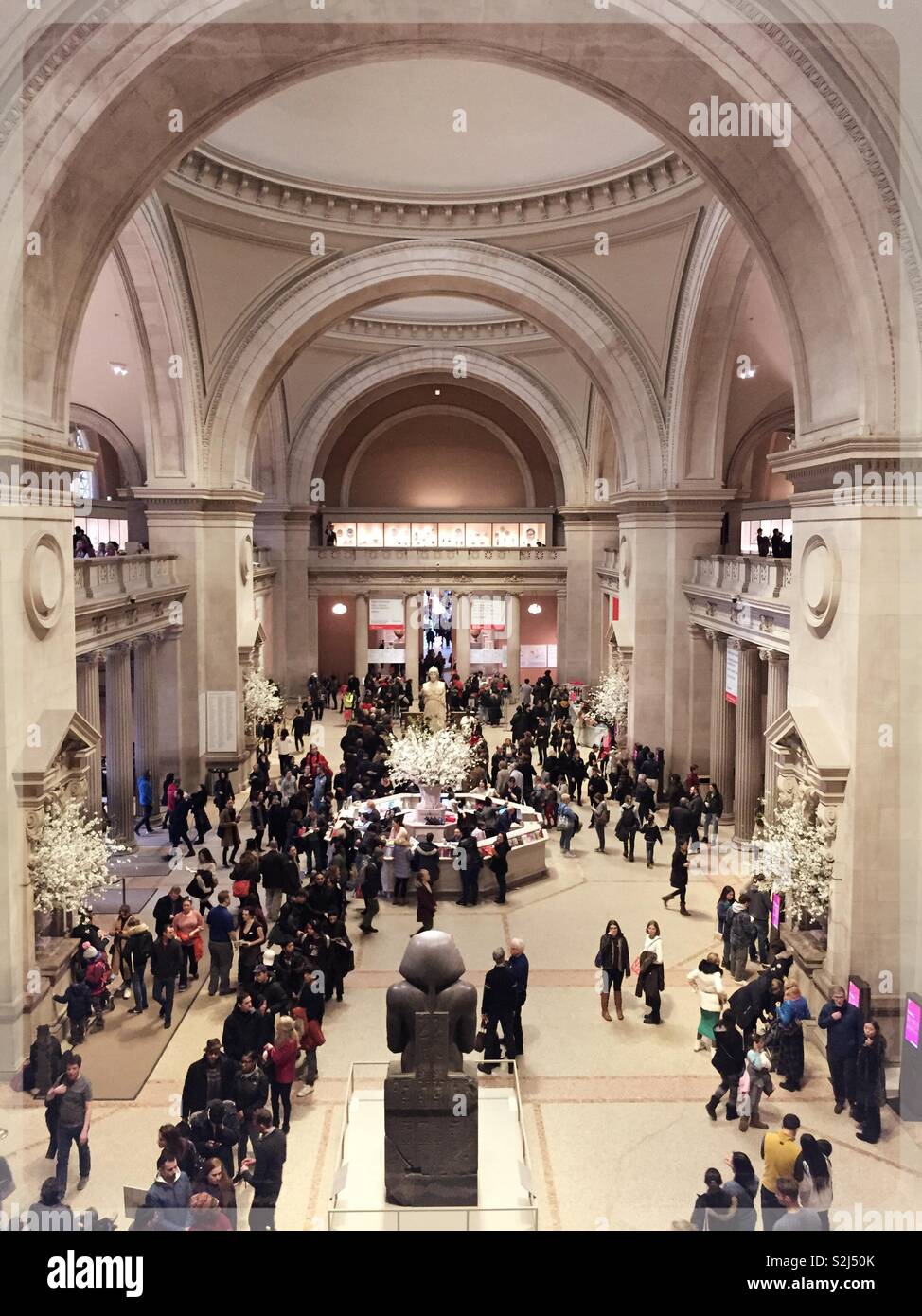 Visitors line up in the grand entrance hall of the metropolitan museum of art in New York City, USA - Smartphone Captured Stock Image