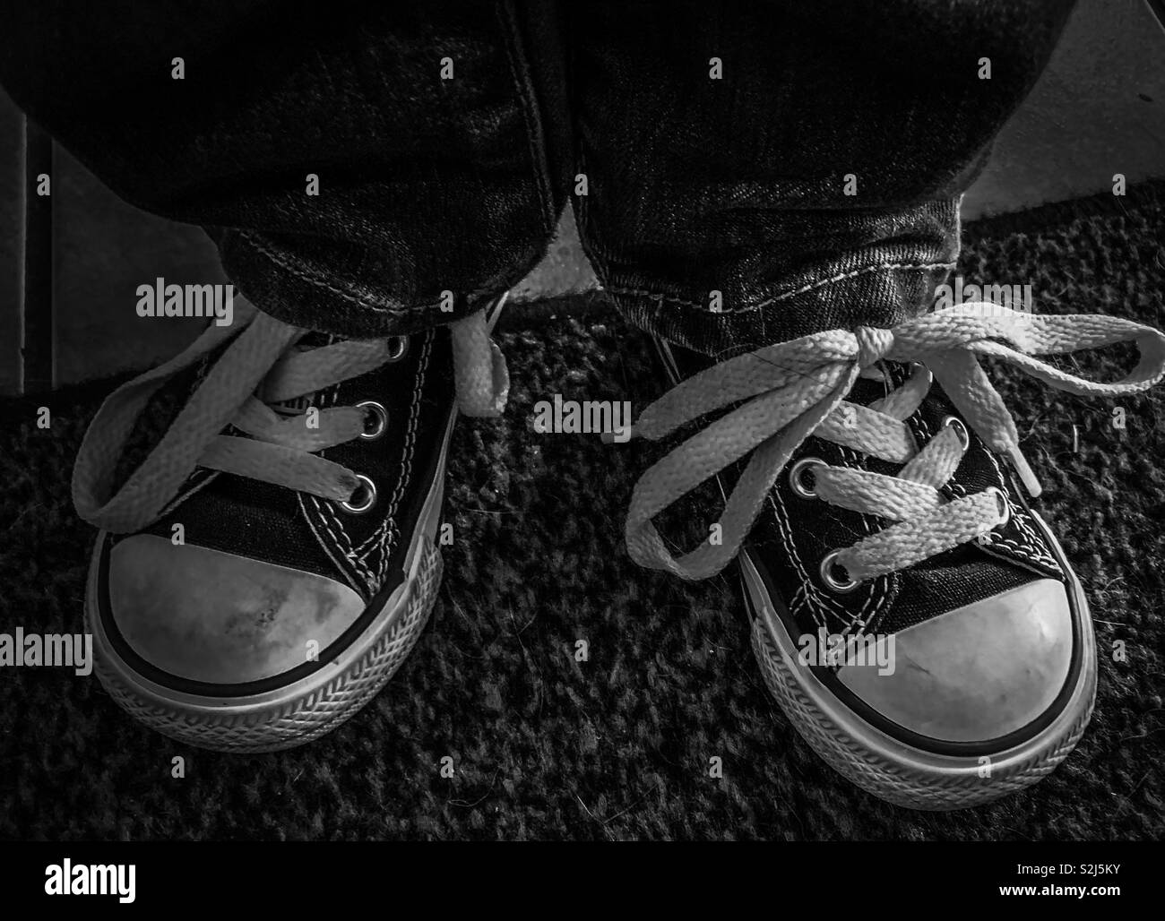 Little boy wearing cool old school shoes Stock Photo