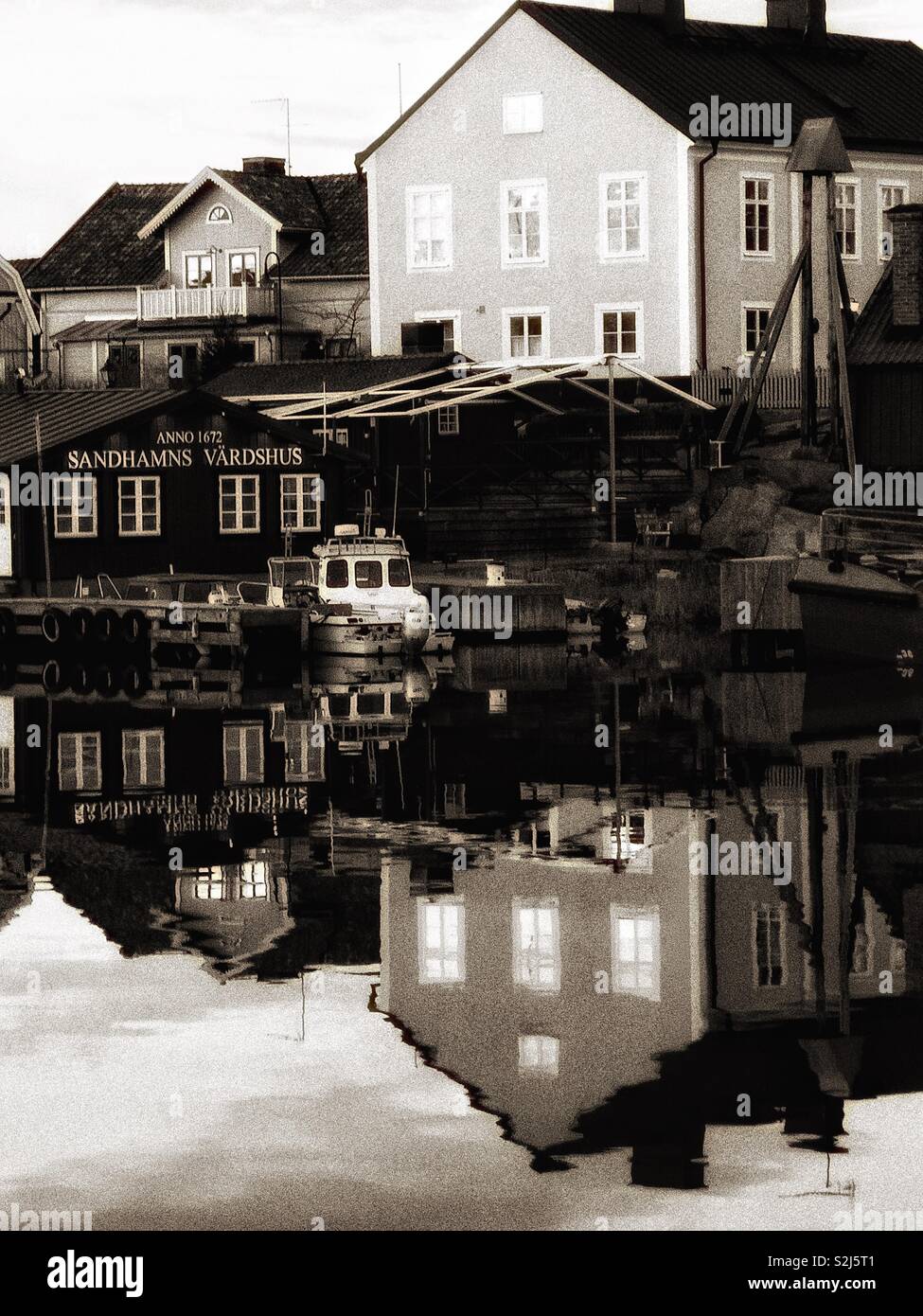 Sandhamn harbour reflection, Sandhamn, Stockholm archipelago, Sweden, Scandinavia. Island in the outer archipelago popular for sailing and yachting since the 19th century - Smartphone Captured Stock Image