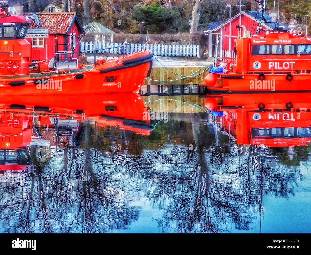 Pilot boats and reflection, Sandhamn Harbour, Stockholm archipelago, Sweden, Scandinavia. Island in the outer archipelago popular for sailing and yachting since the 19th century - Smartphone Captured Stock Image