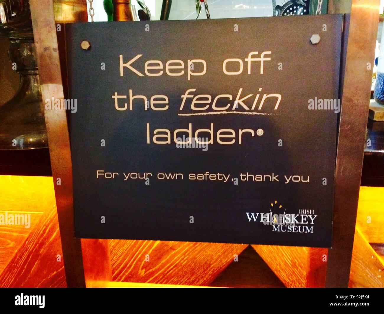 Irish humorous sign board telling people to stay away from the ladder - Smartphone Captured Stock Image