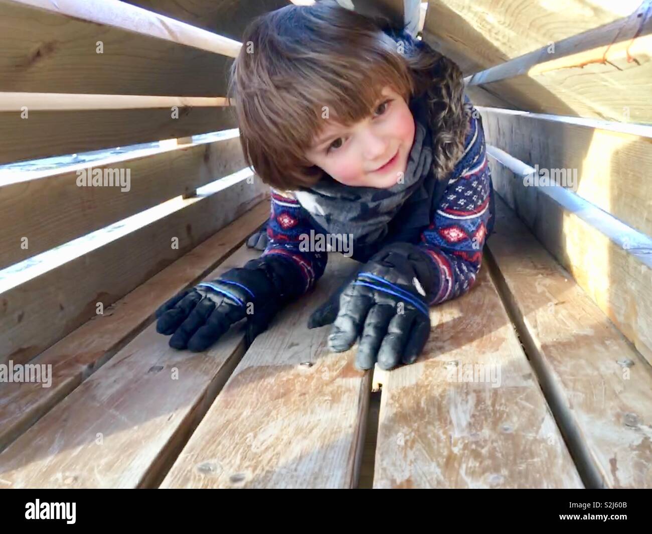 Child in a tunnel at play Stock Photo