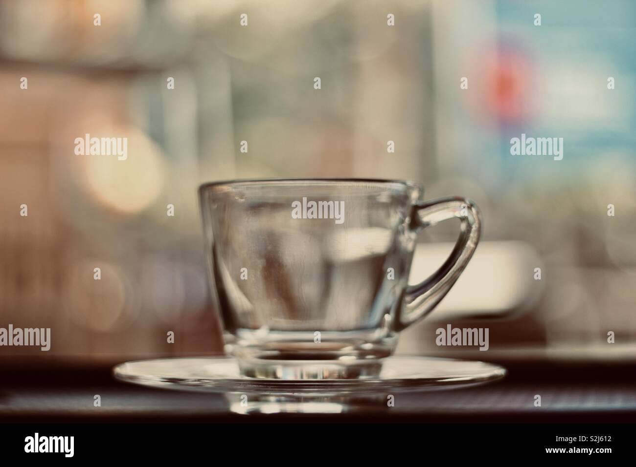 Clear glass cup and saucer Stock Photo Alamy