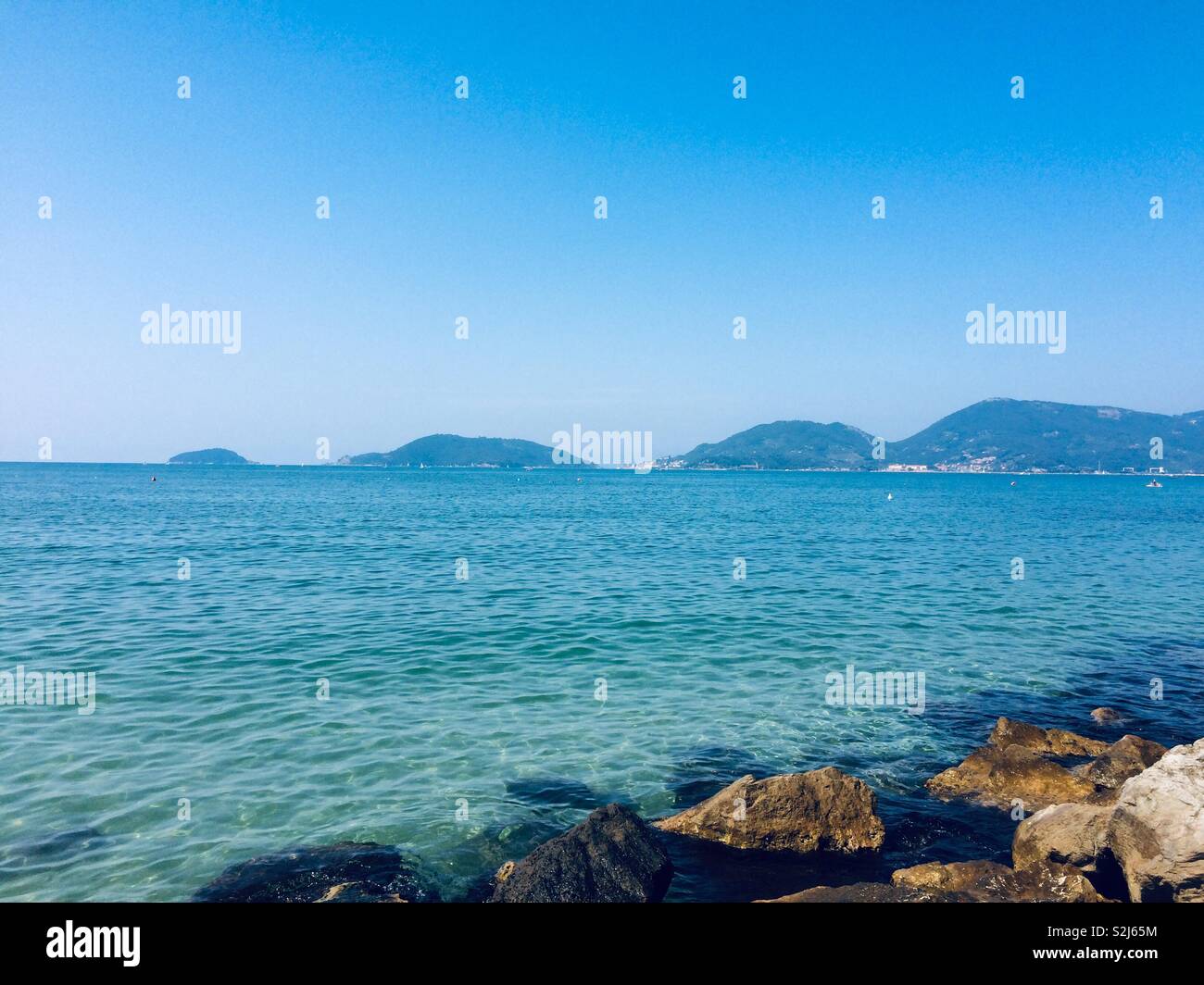 Summer time Portovenere and Le Grazie view from San Terenzo Stock Photo