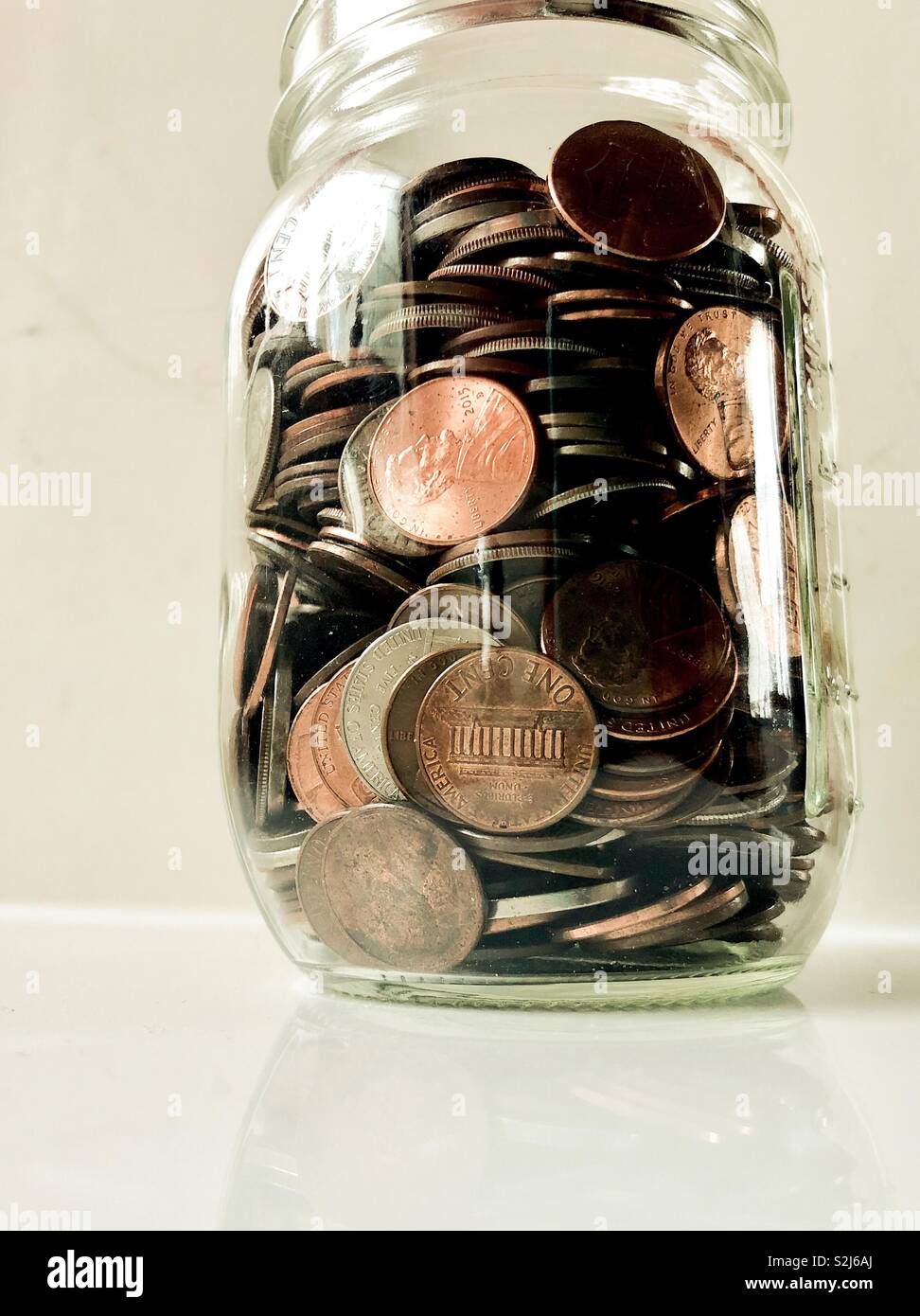 Jar of coins Stock Photo