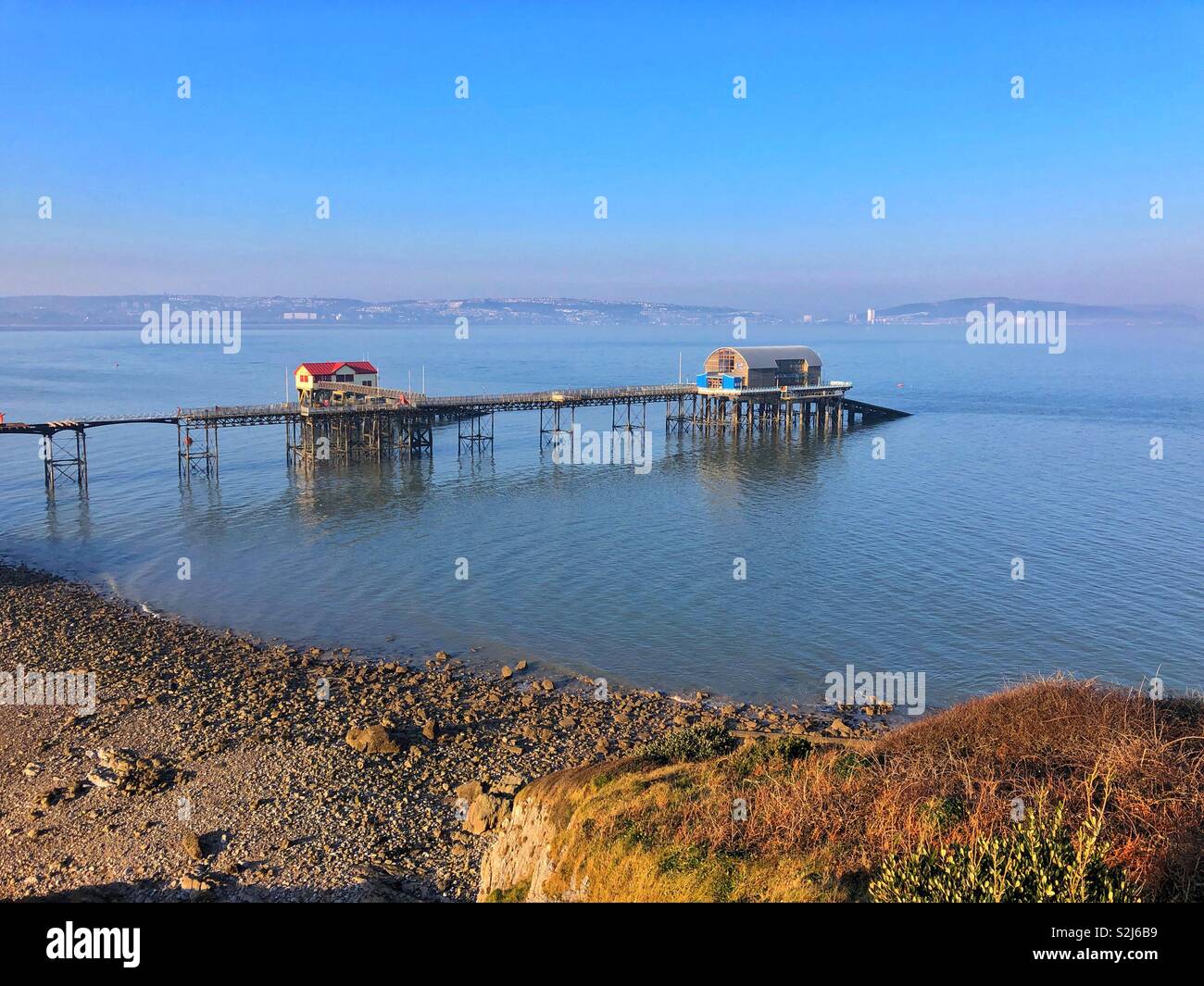 The old and the new lifeboat stations on Mumbles pier, Swansea Bay, South West Wales, February. - Smartphone Captured Stock Image