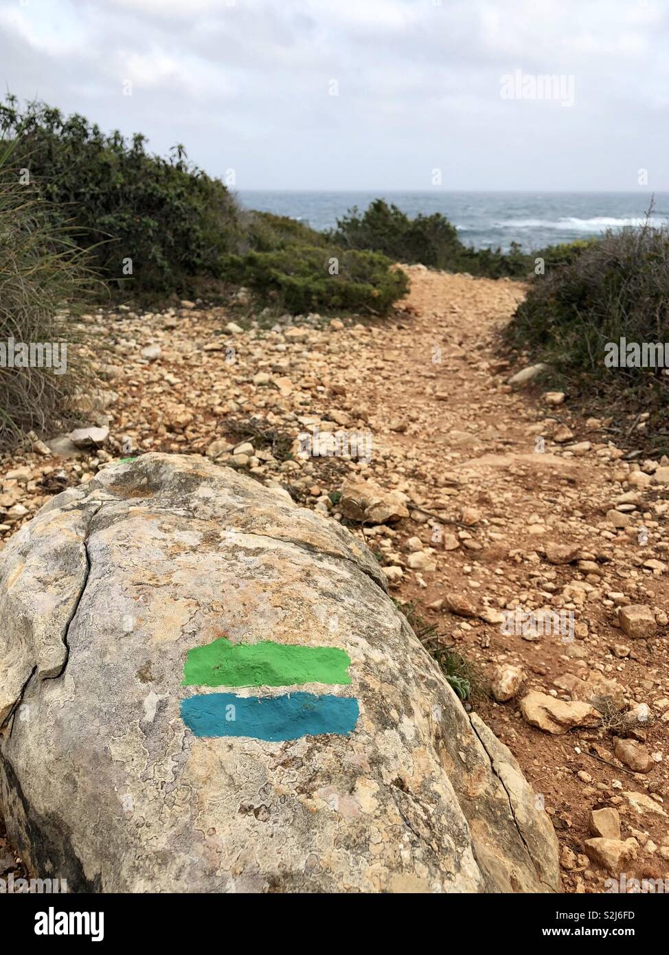 Footpath guide marks on cliff path walk in Portugal - Smartphone Captured Stock Image