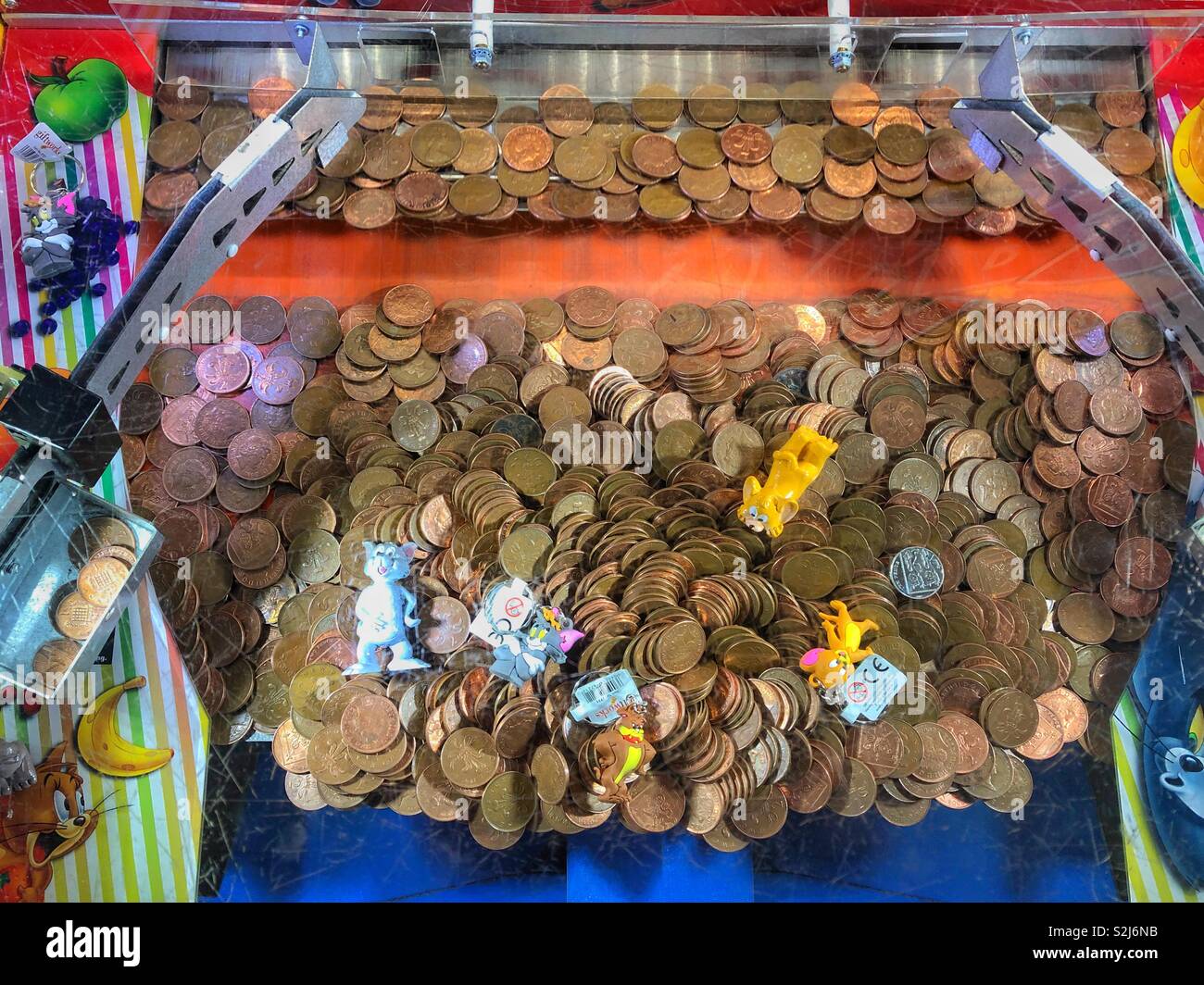 Penny Falls game in an amusement arcade Stock Photo