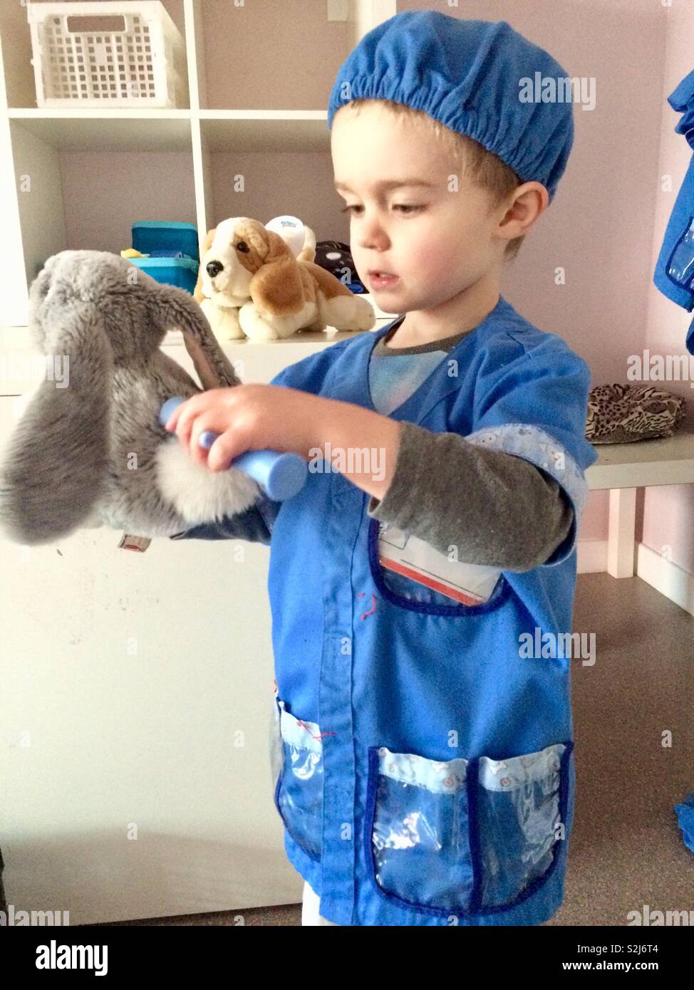 Toddler pretend play vet Stock Photo - Alamy