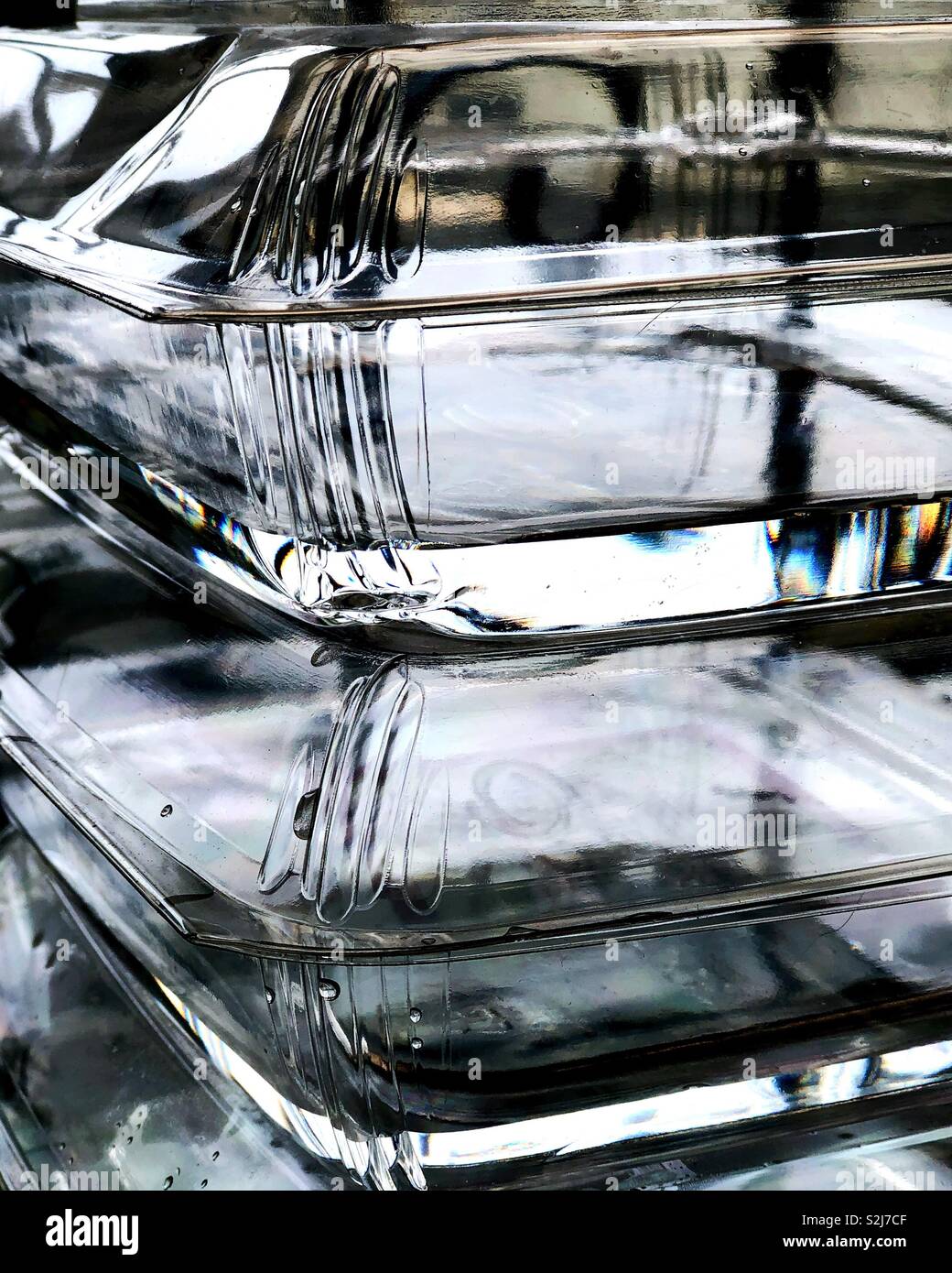 Reflections in two empty plastic containers. Stock Photo