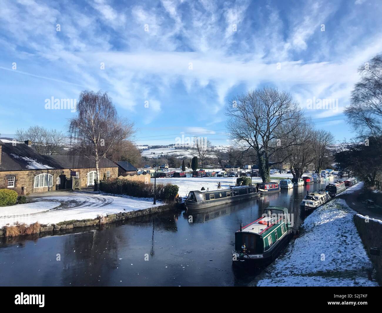 Canal boats in the snow on a sunny day - Smartphone Captured Stock Image