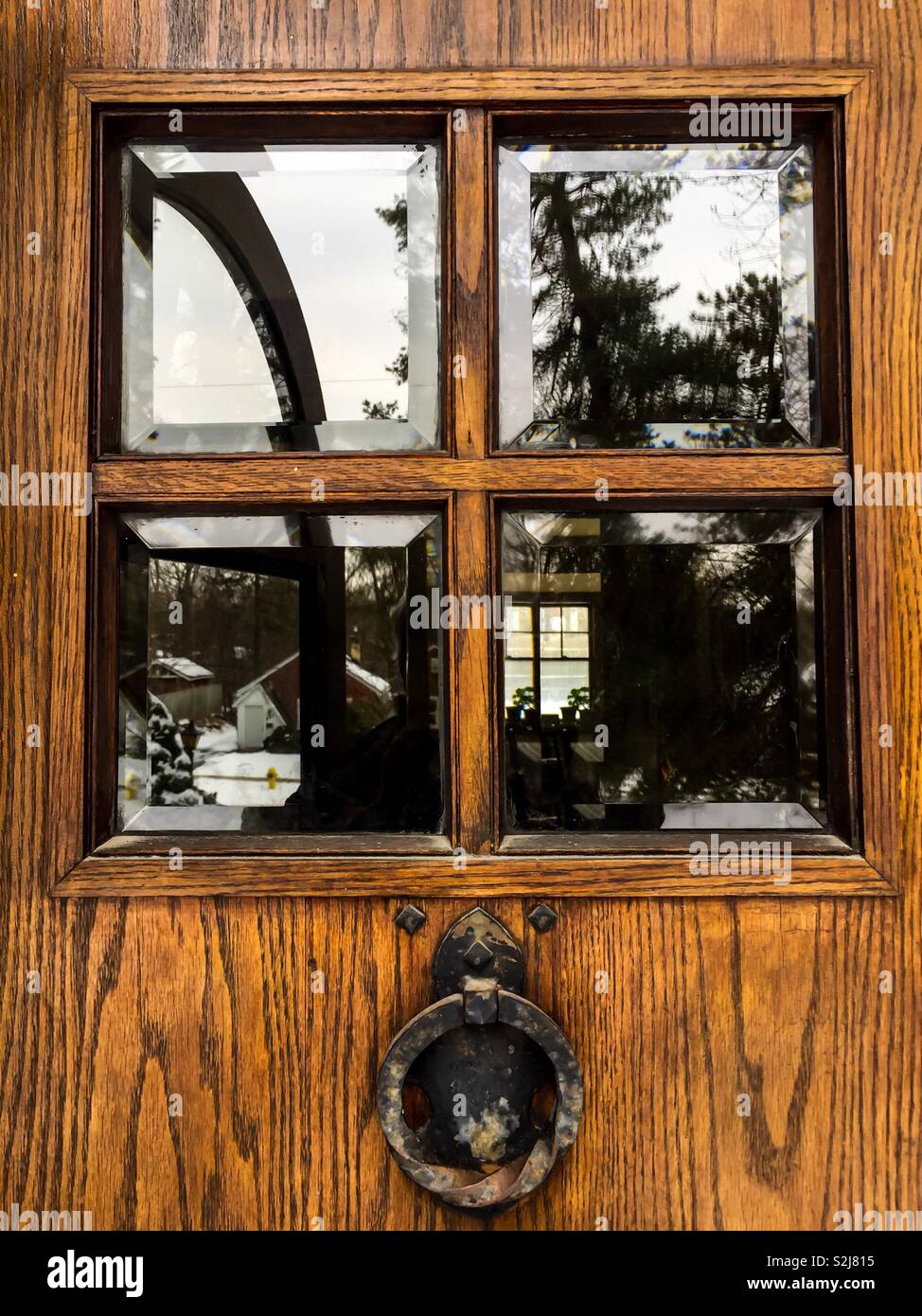 Antique Oak door and knocker - Smartphone Captured Stock Image